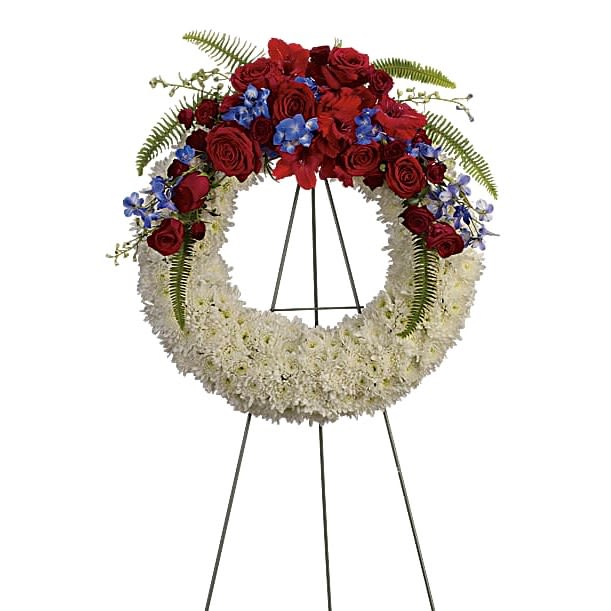 Honor and Glory Wreath - An elegant ring of serene white flowers topped with bold red and blue blooms is a strong and loving tribute to a life distinguished by patriotism, honor and dedication to country.  A distinctive sympathy wreath of traditional flowers such as red roses and gladioli, bright white chrysanthemums, and proud blue hydrangea and delphinium.