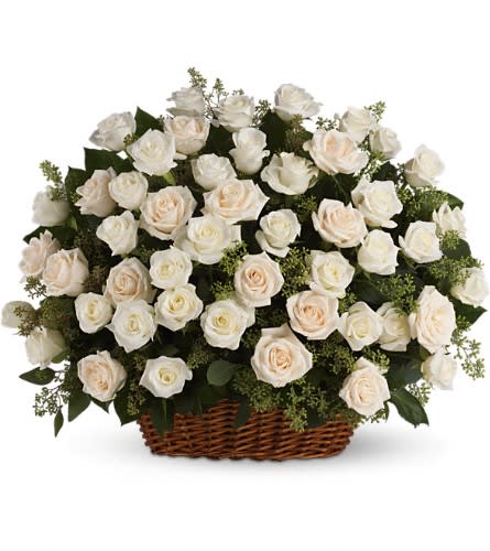 Bountiful Rose Basket - A beautiful bountiful basket of luminous white roses that feels so fresh natural and welcomed in a home or at a service. White and crème roses with fragrant seeded eucalyptus beautifully presented in a large basket. 