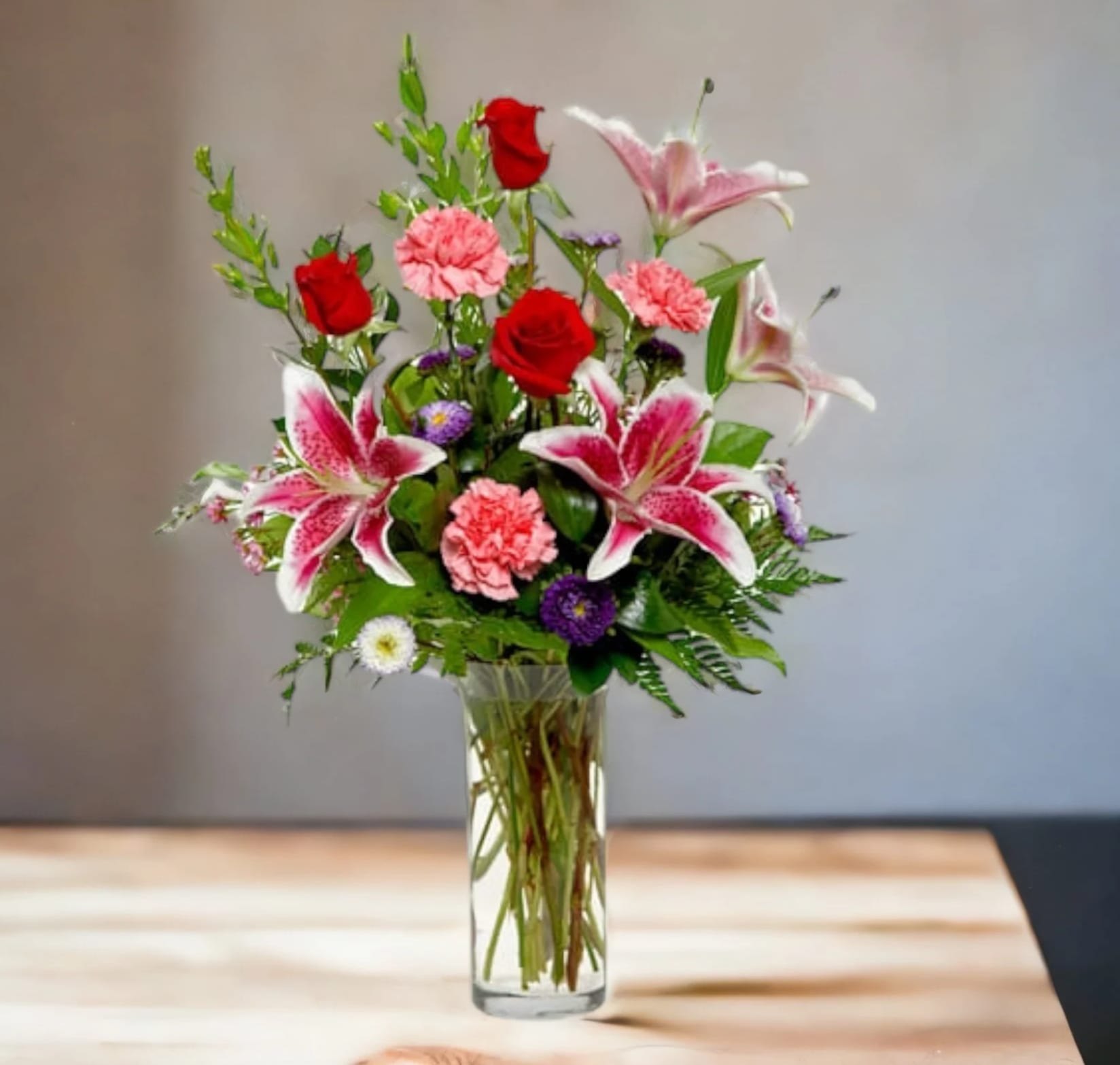 From the Garden - Does someone you know need a pick-me-up? Lift their spirits – and make the day special – by sending this charming display of blushing blossoms in shades of pink, red and purple. It’s the perfect all-occasion, fresh-from-the-garden bouquet.