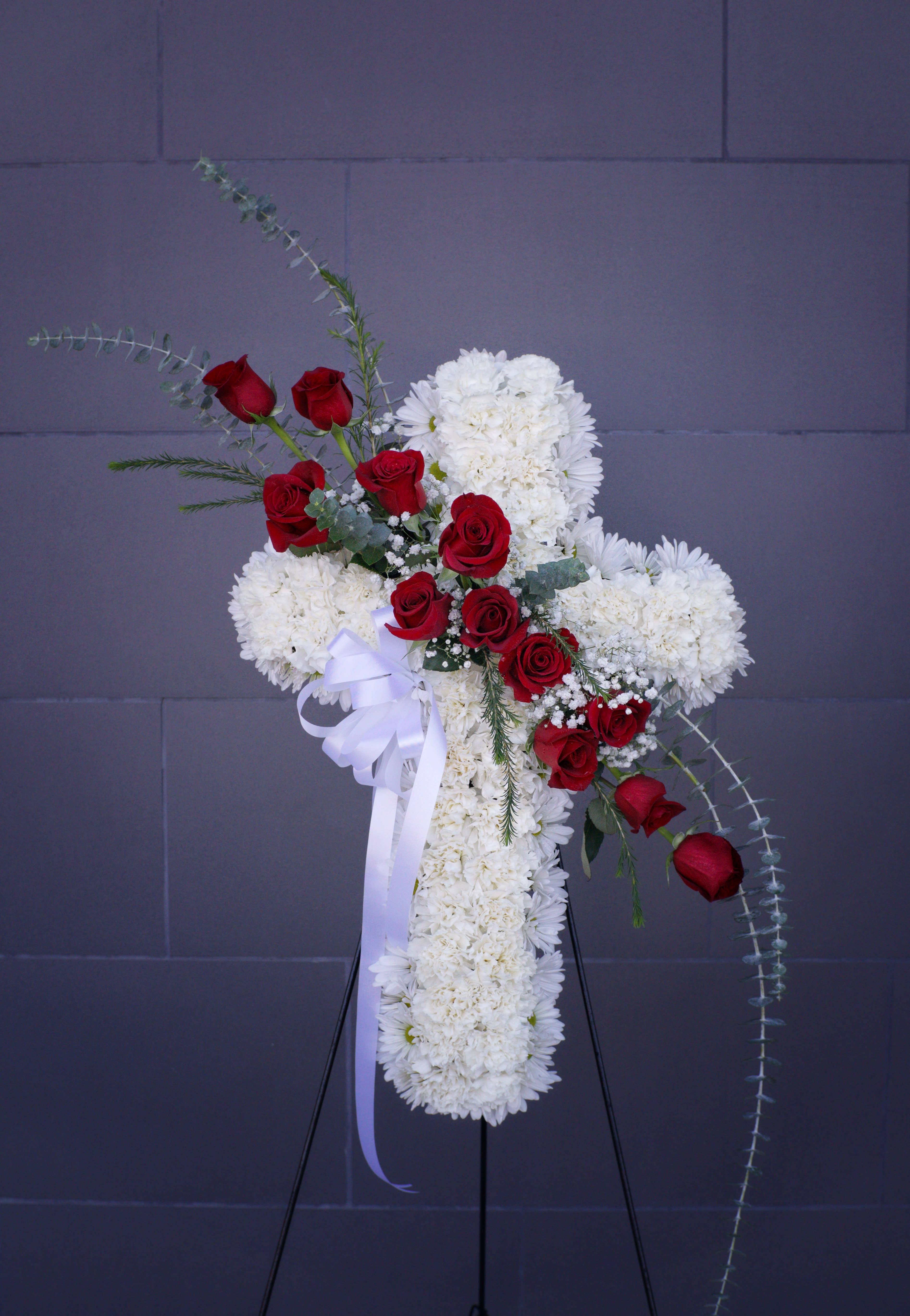 Funeral Cross 2 - Funeral cross including white and red fresh flowers. 
