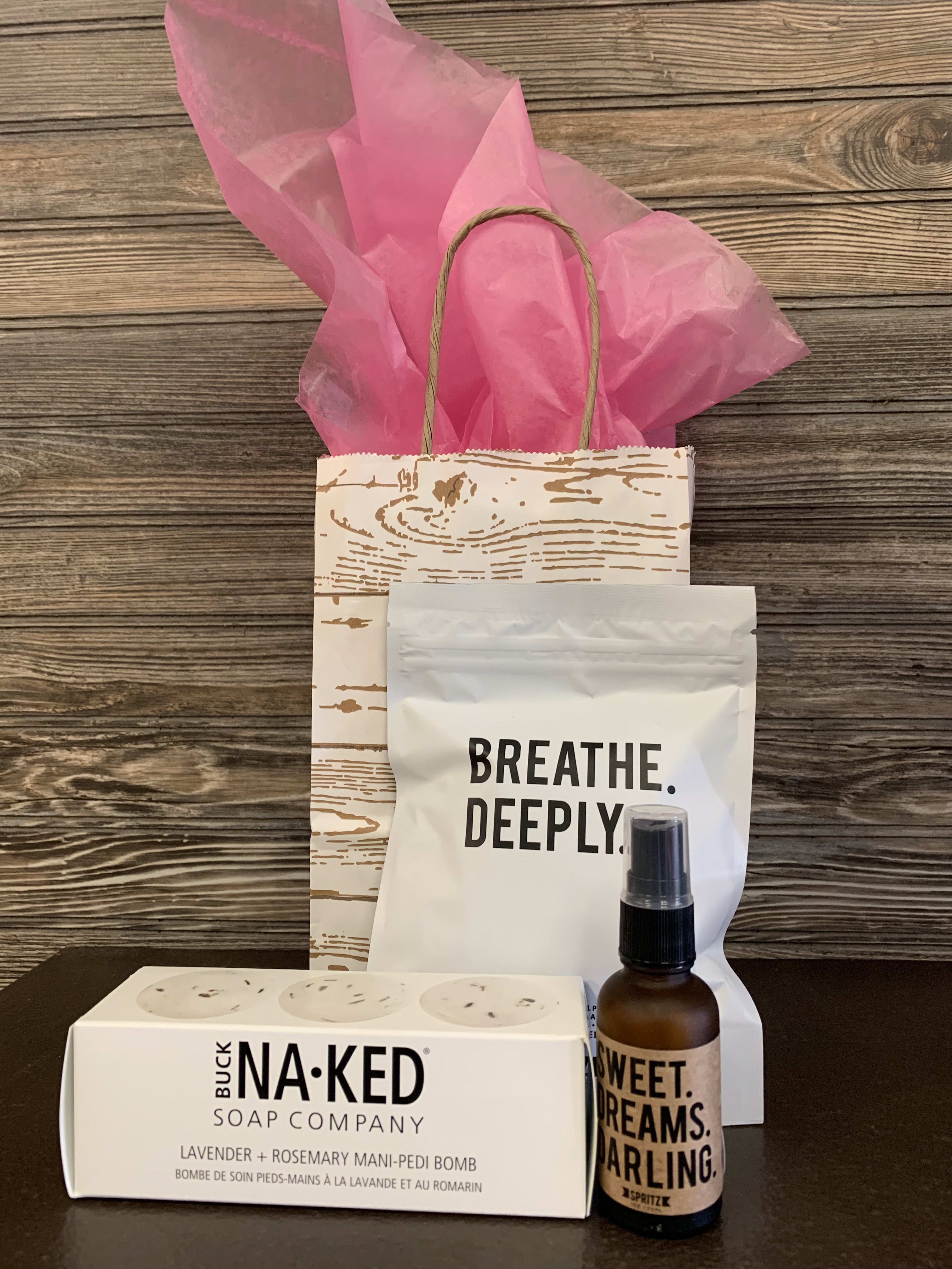 Relax + Breathe Deeply Gift bag  - Breathe Deeply Gift Bag includes 1 Buck Naked Mani/Pedi Bomb, Happy Spritz Sweet Dreams Darling Spray, and Breathe Deeply essential oil wipes in a whitewashed paper bag with tissue and shredded paper.  *Buck Naked's Mani/Pedi Bombs are the perfect way to naturally treat your tender tootsies and fingers, prepping them for the perfect mani or pedi! Each set of 3 bombs is made with their traditional all-natural and vegan formula to maximize moisture and softness. Bath bombs individually shrink-wrapped in biodegradable film. The box is Carbon Neutral and Recyclable. Ingredients: Sodium Bicarbonate, Citric Acid, Sodium chloride (Sea Salt), Magnesium Sulphate, Lavandula Angustifolia (Lavender) Flower, Carthamus Tinctorius (safflower) oil, Aqua, Parfum (Essential Oil) *Sweet Dreams Spray 10oz, Essential Oil Calming Lavender Bland, Facial, pillows before bed, relaxing, soothing, comforting, balancing, grounding. Ingredients are water, Lavender, vanilla, camomile, and other 100% essential oils  *Breath Deeply Essential Oil Towelettes: 7 individually wrapped Peppermint + Eucalyptus towelettes, meant for invigorating, cooling, soothing, &amp; stimulating. Ingredients: water, polysorbate 20, eucalyptus oil, organic peppermint oil, organic tree tea oil, organic lemon oil, honeysuckle flower extract, leuconostoc radish root ferment filtrate,  citric acid. 