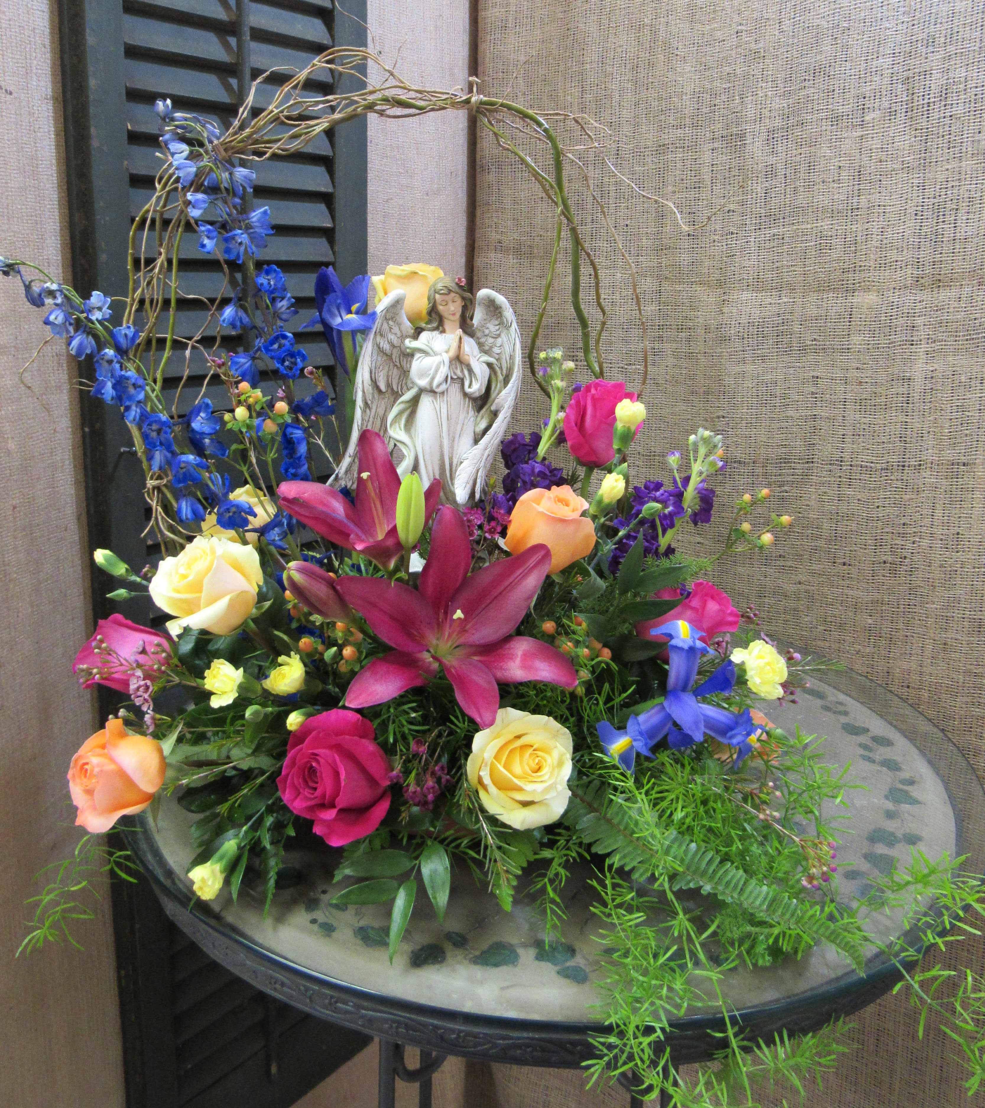Angel &quot;Halo&quot; Garden - Send this beautiful garden with arbor setting, perfect for the angel it showcases in the center. This is a lovely tribute for any service. *Keepsake gifts will be very similar as our suppliers change their inventory with trends. Haehn Florist &amp; Greenhouses in Wapakoneta, OH #haehnflorist #wapakoneta #flowershop #greenhouse #flowers #gifts #shoplocal #familyowned