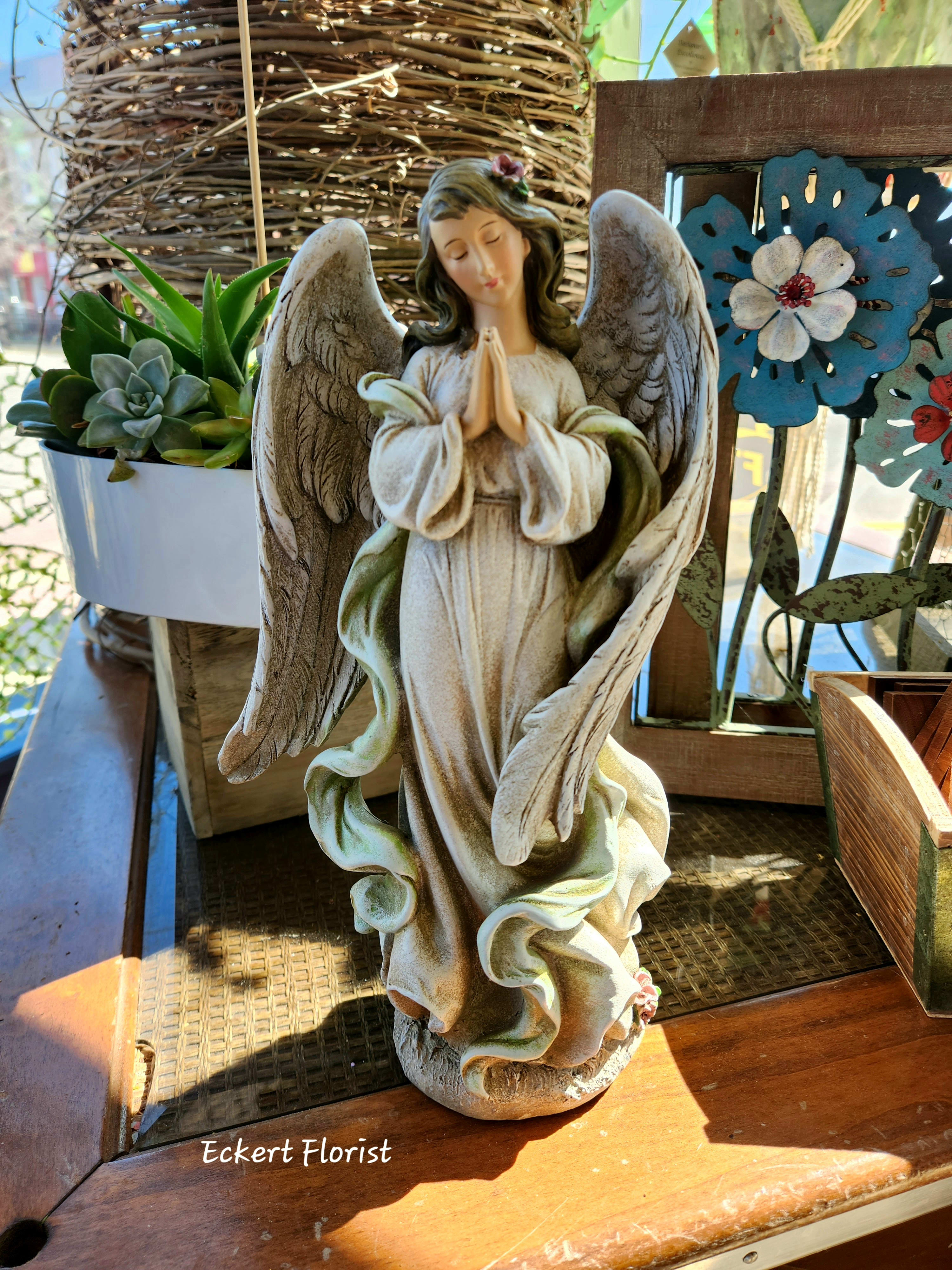 Eckert Florist's Praying Angel Eckert Florist's Praying Angel - Resin material angel measures approx. 11.5" H x 6.5" W *OUR LOCAL DELIVERY ONLY