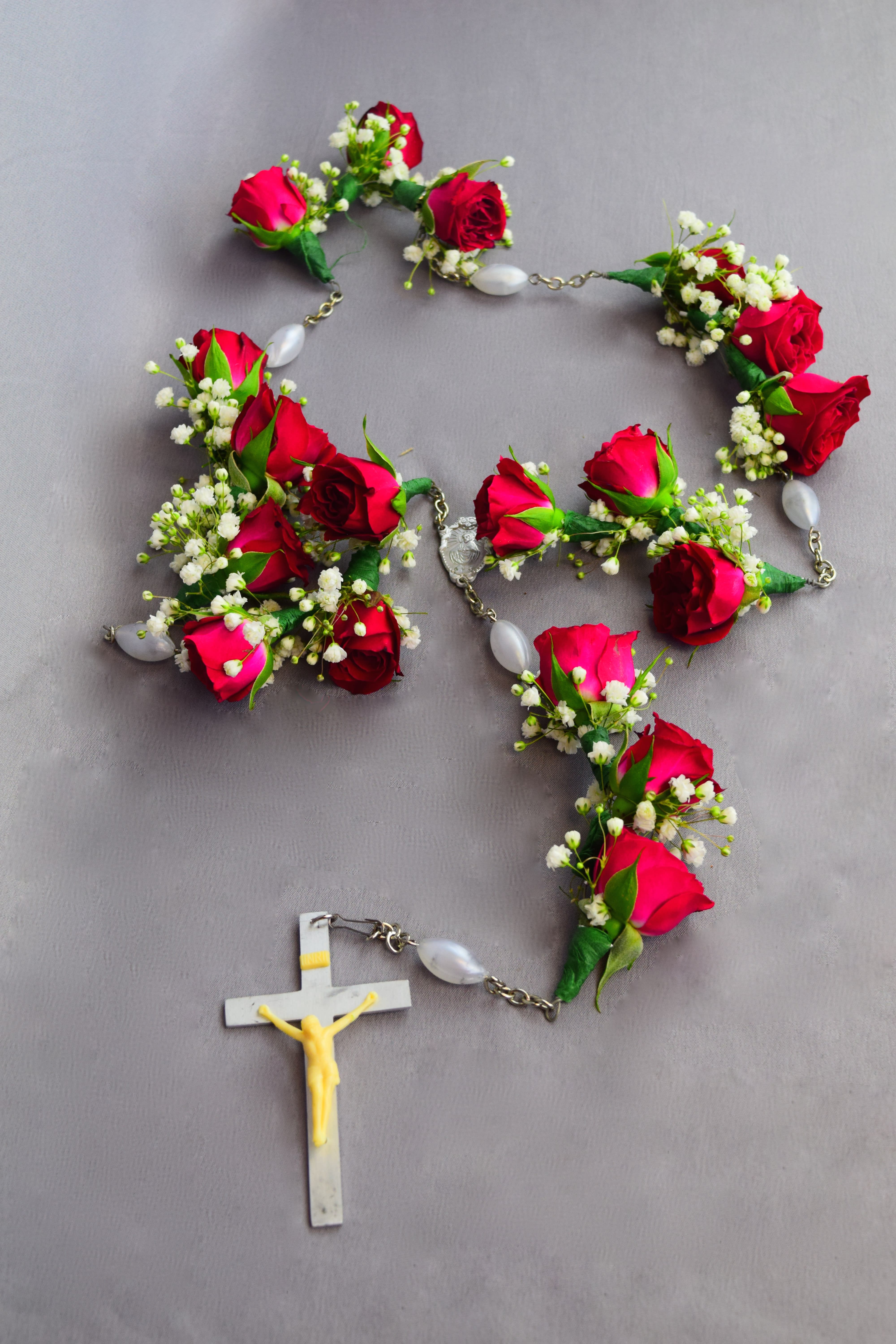 Floral Holy Cross  Rosario/Rosary  - Floral Holy Cross/Rosario (mini-roses)  Comes in 3 sizes (Hand Rosary, Half Casket, and Full Casket) Priced in deluxe and premium categories.