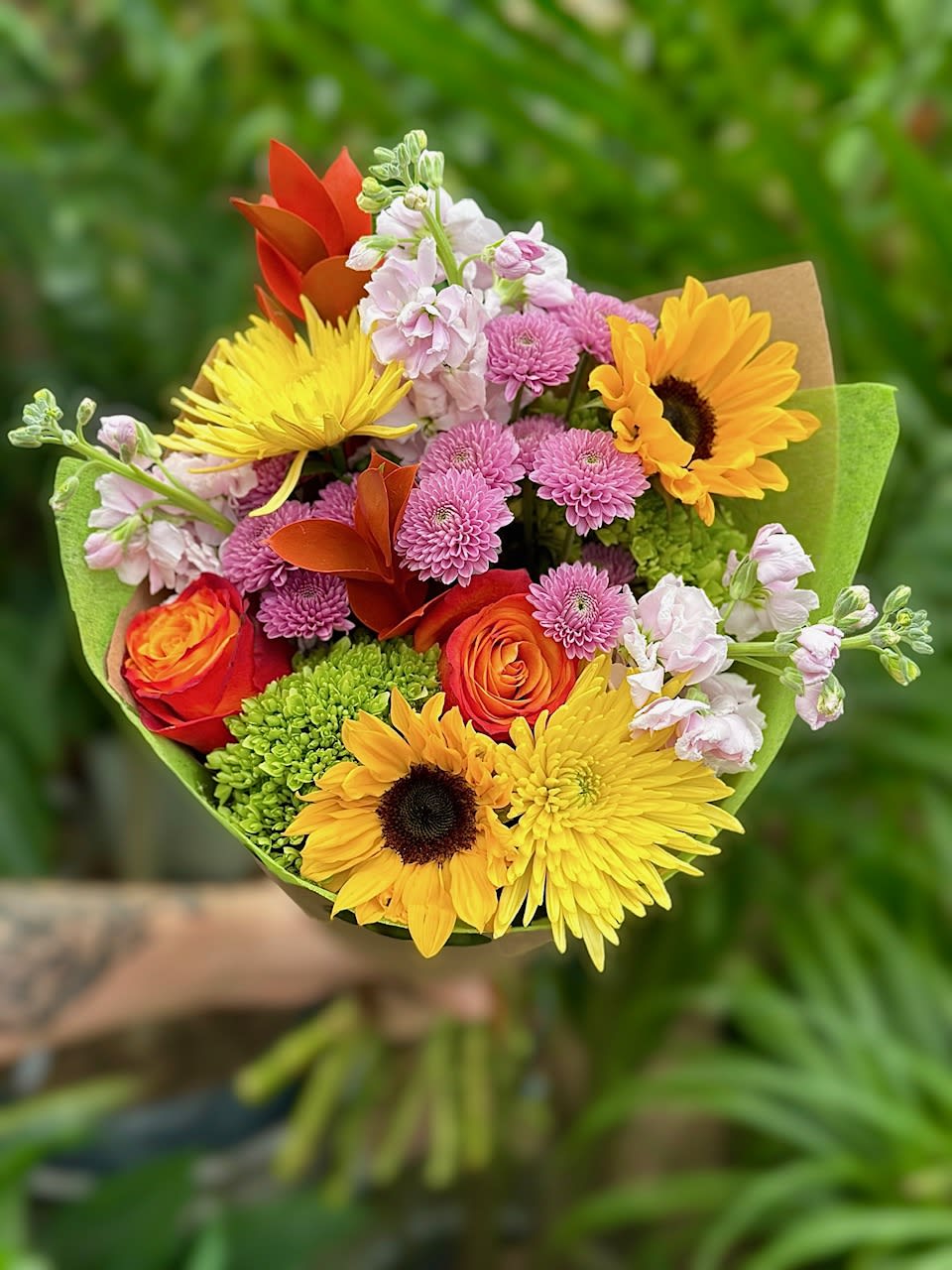 Designers Choice- Loose Flower Bundle  - Our designers will put together a beautiful, bright mix of flowers and wrap them up so you can easily drop them in a vase at home! 