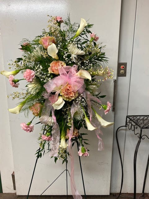 Pretty in Pink Pretty in Pink - This bouquet is full of pink roses with white Calla Lilies and babies breath to create a soft feel to the arrangement.
