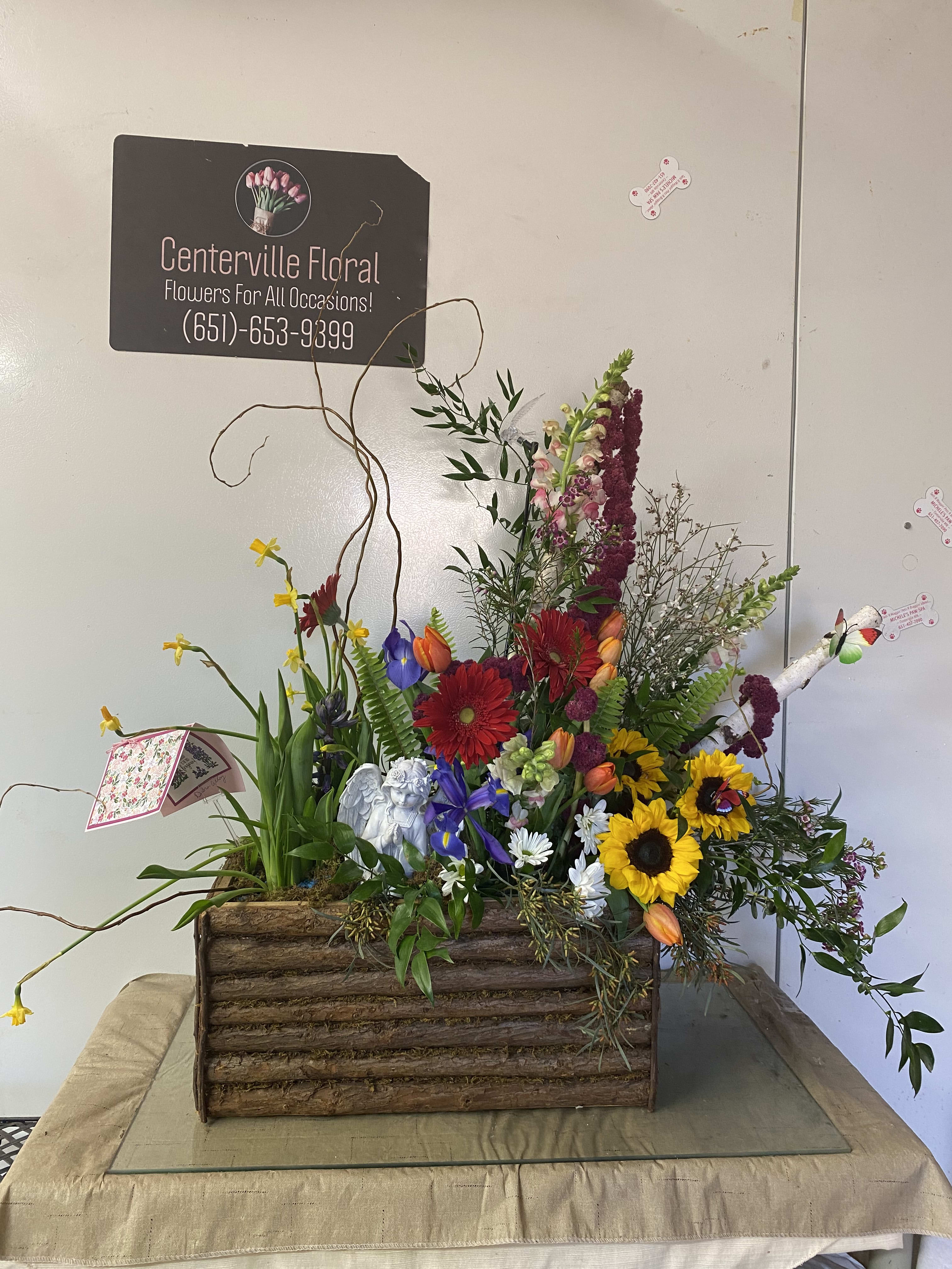 sunflowers, gerberas, and rustic items - We can make this arrangement to your liking. We customize all arrangements