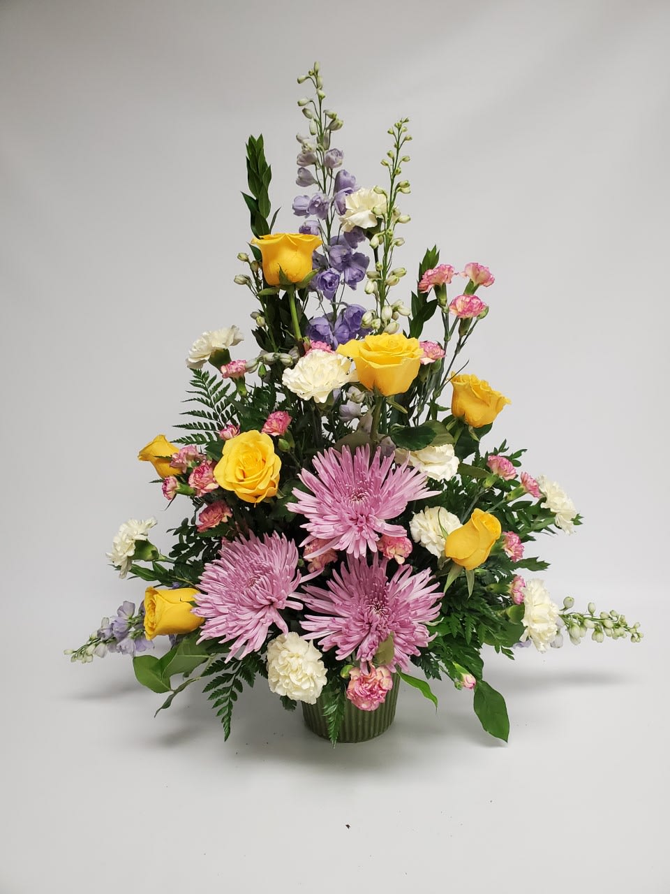 Roses, Cushion Mum,  - beautiful one sided arrangement. great for an funeral or on the alter for a wedding.