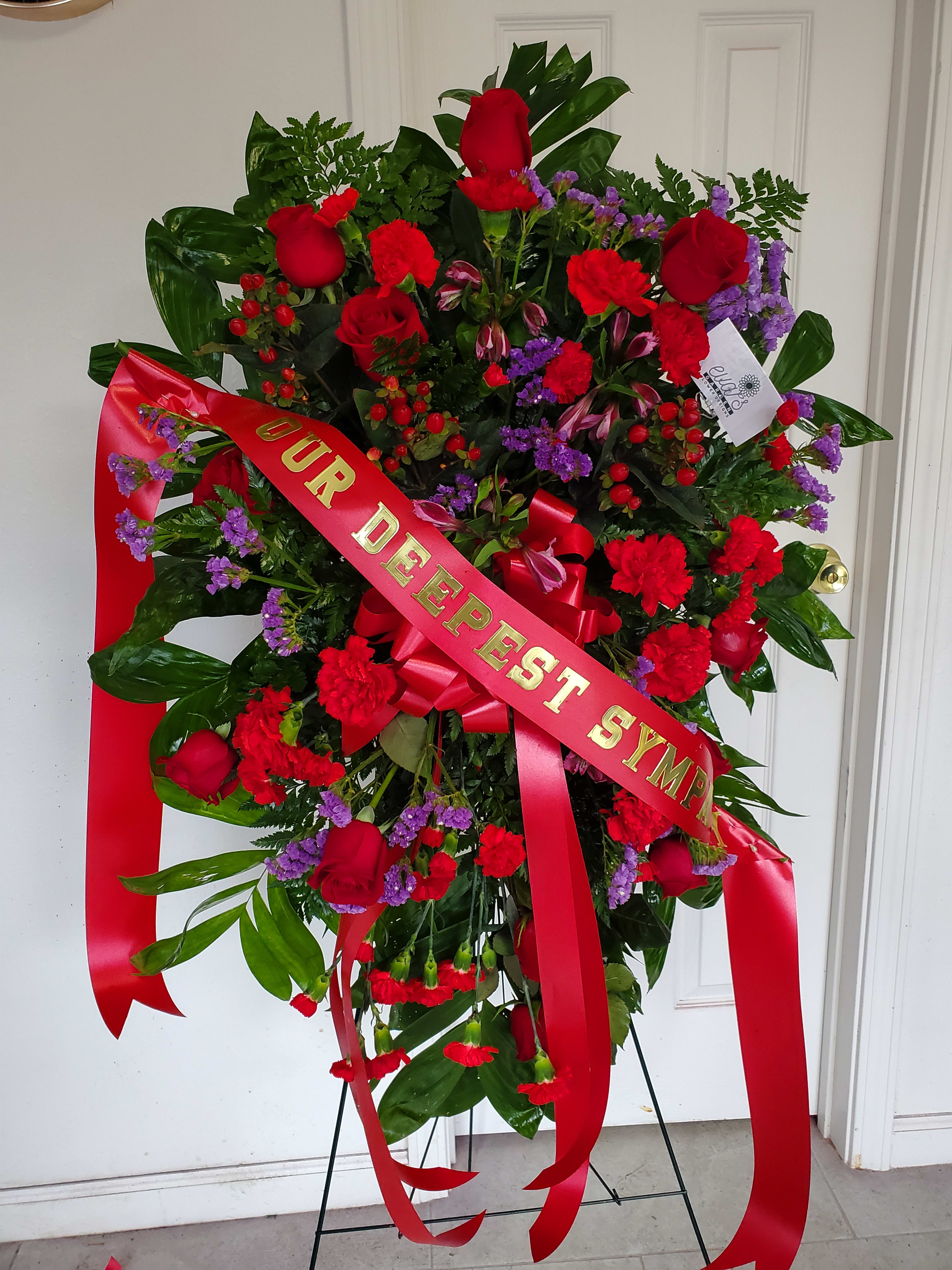 Purple &amp; Red Funeral Spray - Purple and red funeral spray with roses, statice, carnations, and alstroemeria.   (Picture depicts a deluxe product; standard &amp; premium size available upon request)