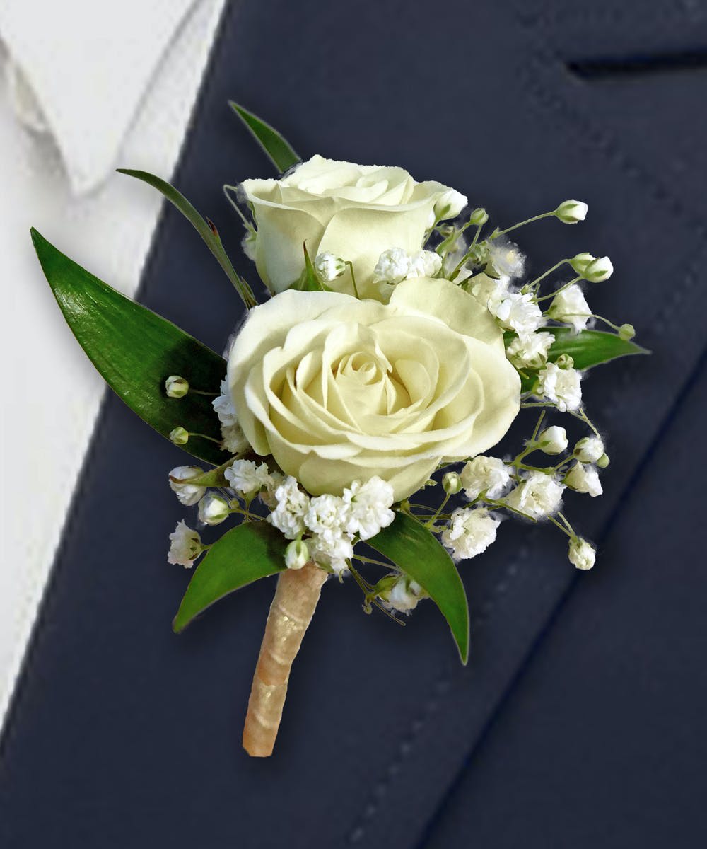 White spray Rose Boutonnière by Atlanta's Finest Flowers  - A classic white boutonnière that compliments any suit. A perfect addition for any prom, formal, or wedding event. 