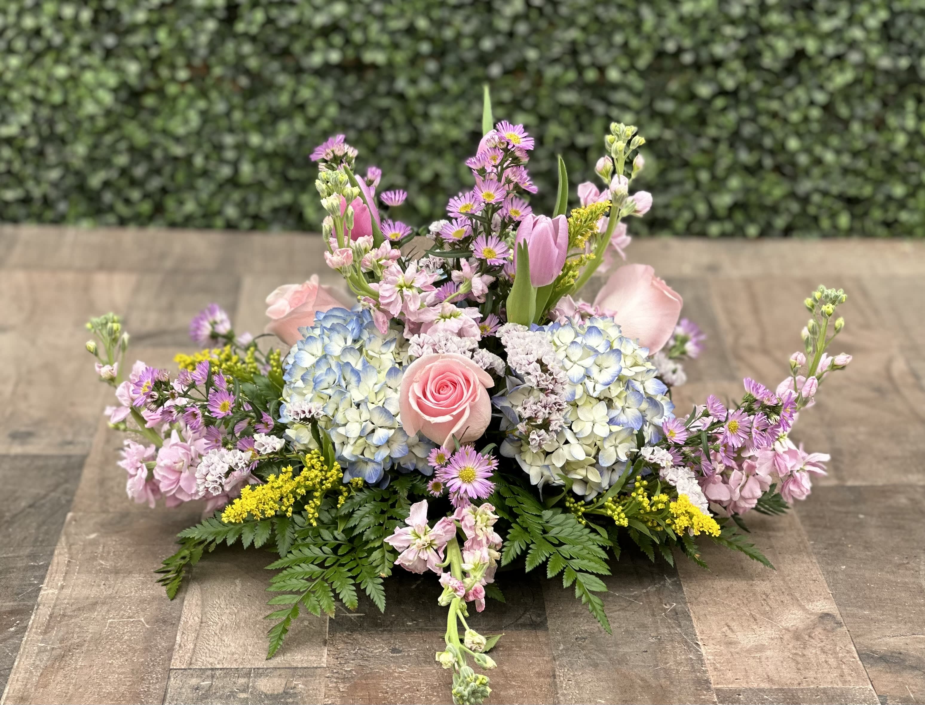 PASTEL ROUND CENTERPIECE by Hirni's Wayside Garden Florist