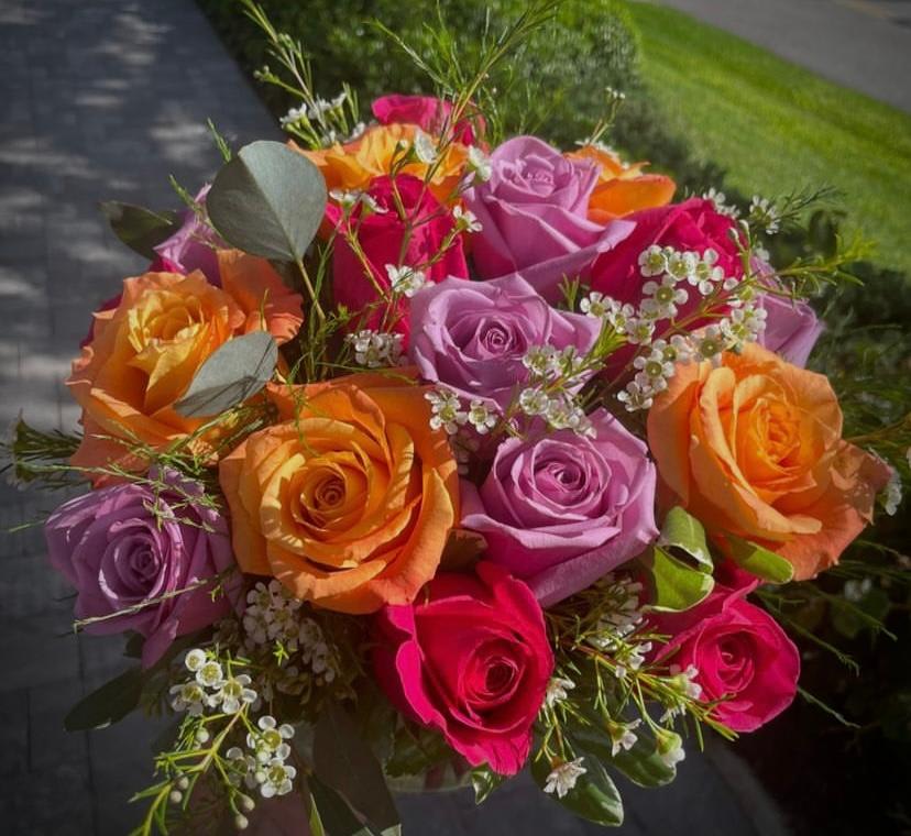 CFES6 CFES6 - A low compact style arrangement of all roses beautifully arranged with mixed greenery and filler flower accents.