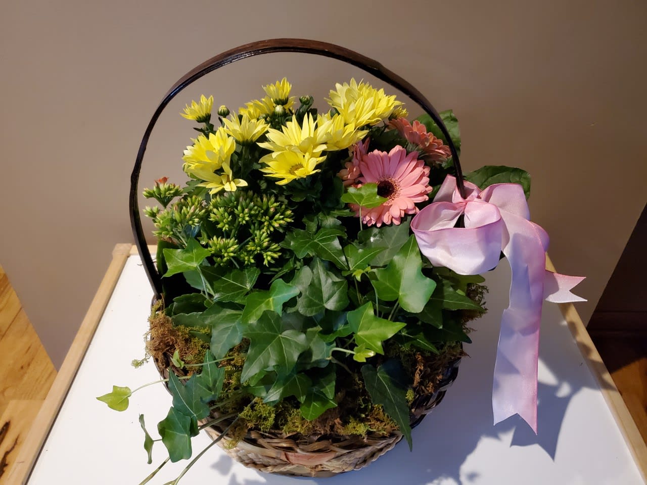 Plant Basket - Two green plants and two flowering plant. this can be made with your preference of plants that are in at the time.