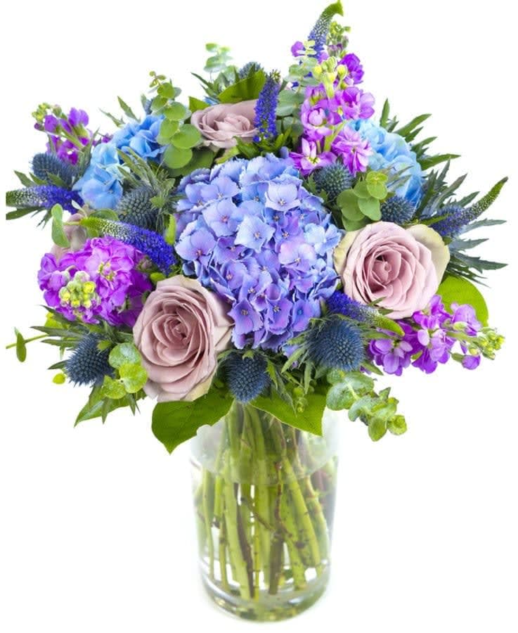 Dynamic bouquet Dynamic bouquet - A dynamic bouquet with excellent colour combinations using the darker shades. The sensational Amnesia Rose, with the blue Hydrangea and Lilac Stocks make this the ideal special gift for a man or a baby boy.