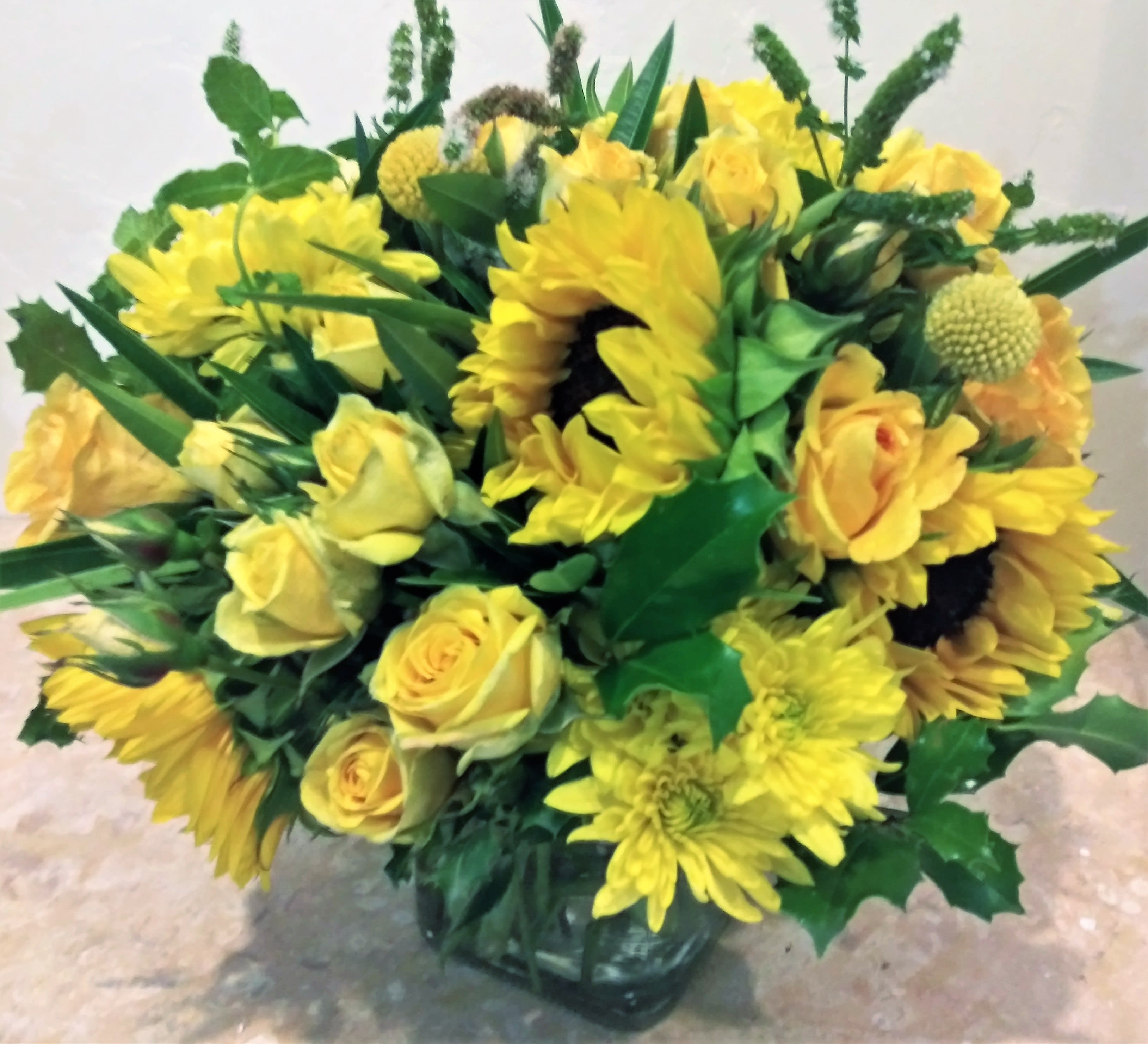 Sending you some sunshine. - This fresh floral arrangement is perfect for any occasion. 