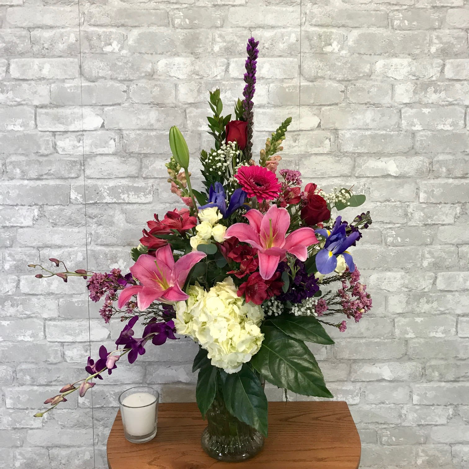 Hugs and Kisses FG201 - This amazing arrangement includes hydrangea, roses and lilies in a beautiful vase.  Hugs and Kisses will be coming your way when this gift is received.   Approximately 34&quot; H and 28&quot; W.