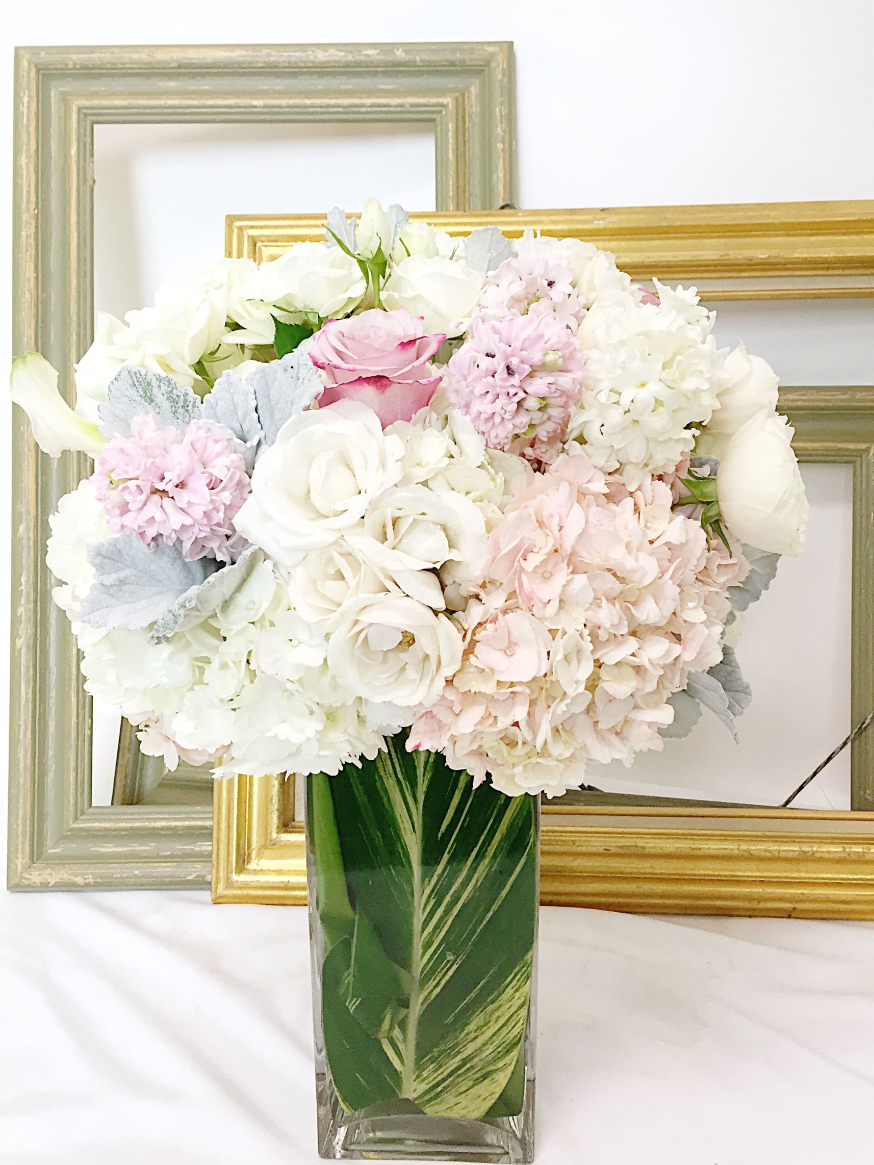 Peace Peace - Beautiful spring color flower combination in vase with inserted green leaf. This arrangement will make anyone happy and delightful. It will become the talk of the day upon delivery.