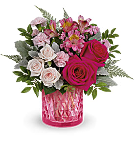 Vintage Elegance Bouquet - Take their Valentine's Day breath away with this stylish pink rose bouquet, presented in an artisanal mosaic vase of stained glass that swirls in stunning shades of pink. This bouquet features hot pink roses, light pink spray roses, dark pink alstroemeria, miniature pink carnations, pink sinuata statice, leatherleaf fern, huckleberry and dusty miller. This Valentine's Day arrangement is delivered in Teleflora's Vintage Elegance cylinder. Approximately 15&quot; W x 13 1/2&quot; H
