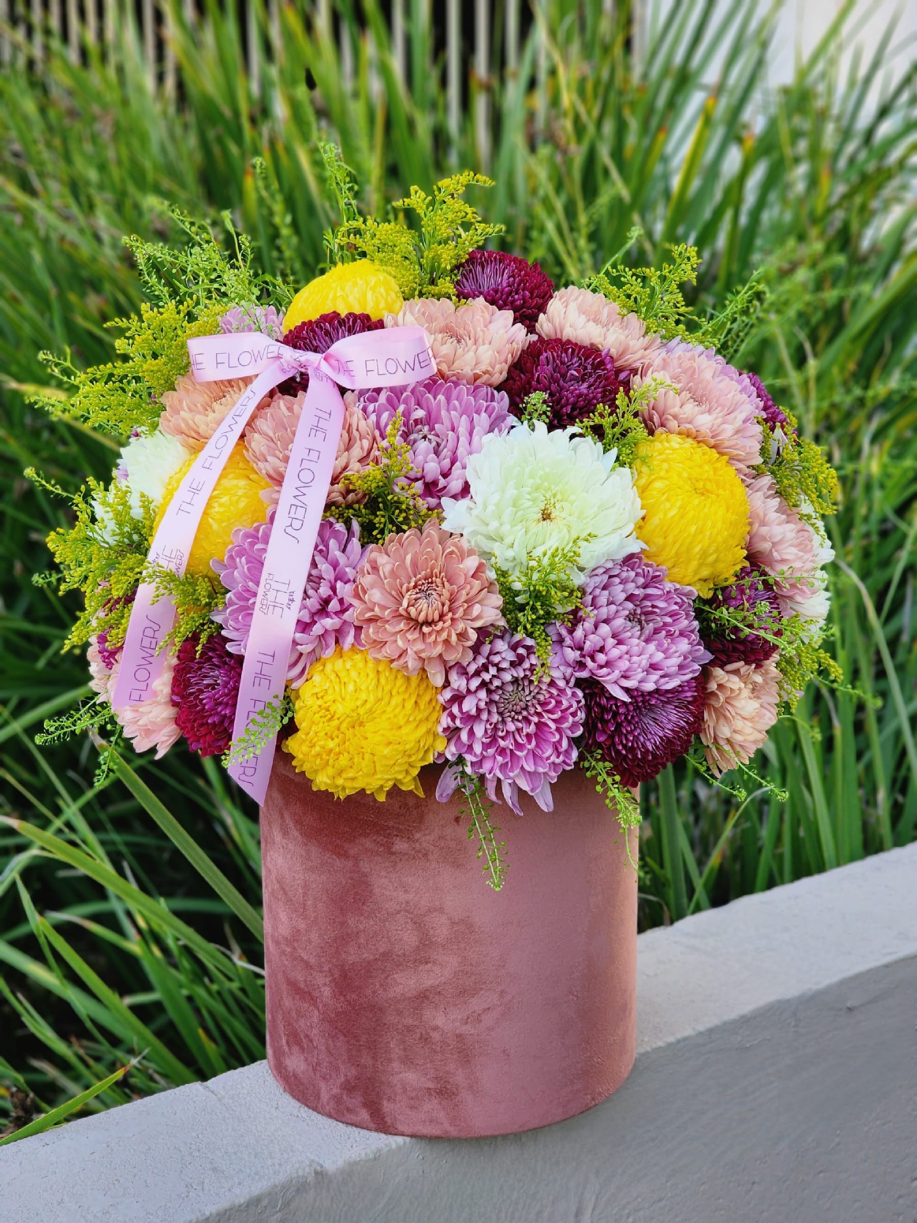 Dreaming  - Burgundy, lavender, and yellow chrysanthemums in an elegant velvet box look exquisite and attract attention. Such a composition can be presented to your loved ones, friends, and family.  Bright bouquets increase motivation and efficiency.
