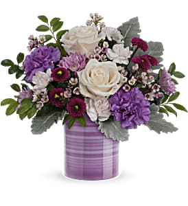 Serene Swirl Bouquet - Swirling with hand-painted bands of soft lavender, this sweet ceramic keepsake vase makes a marvelous gift filled with a bouquet of creamy roses and purple blooms.