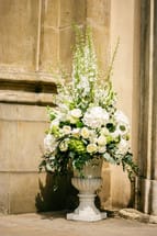 ELEGANT BLOSSOMS - A BEAUTIFUL ARRAY OF ALL WHITE BLOOMS, FEATURING ROSES. CONTAINER MAY VARY.
