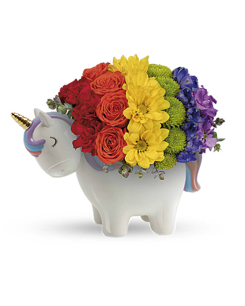 Dreaming of Rainbows Bouquet - Color them thrilled when a radiant rainbow bouquet arrives in this adorable glazed ceramic unicorn with handpainted details and a magical golden horn! This colorful gift includes orange spray roses, miniature red carnations, yellow daisy spray chrysanthemums, green button spray chrysanthemums, blue delphinium, purple stock and parvifolia eucalyptus. Delivered in Teleflora's Charmed Unicorn Keepsake.