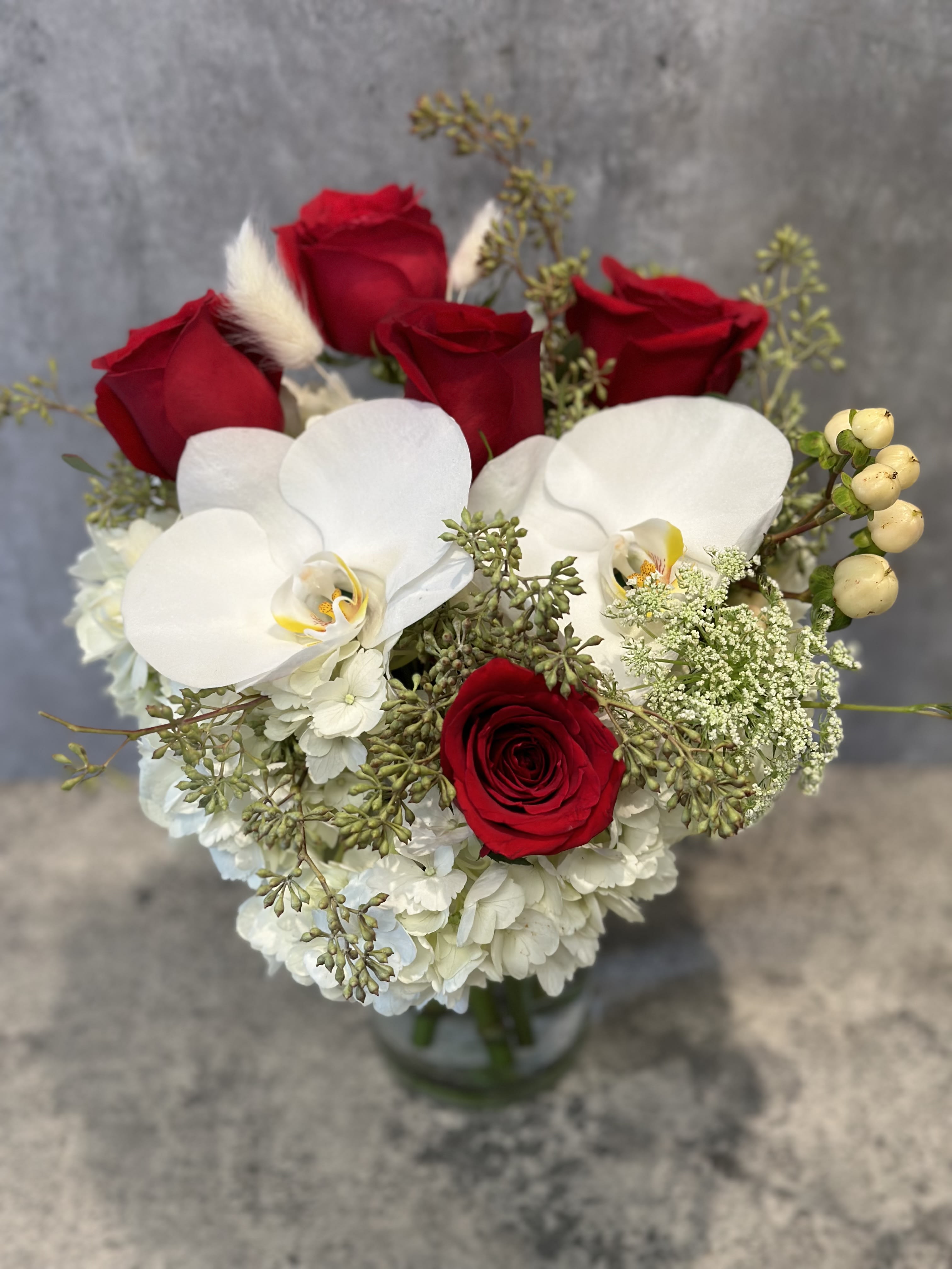 Red roses orchid in vase  - Standard- Your order will be arranged approximately as shown on our website.