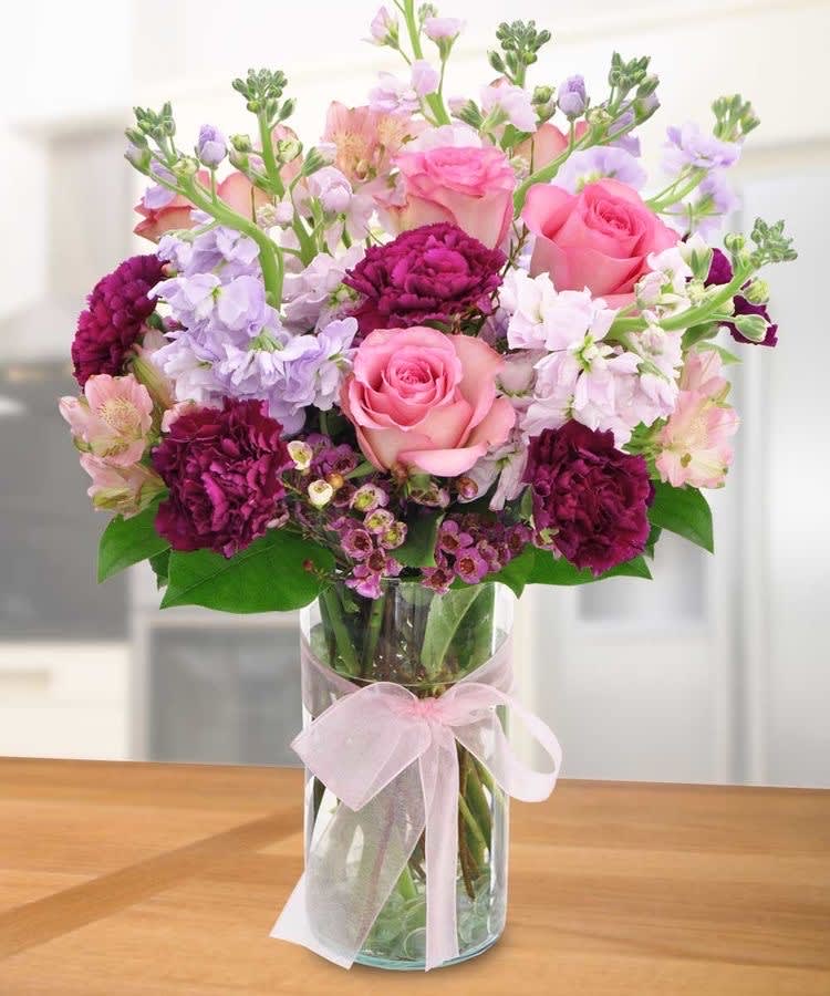 Radiant Bouquet Radiant Bouquet - Beautiful pink roses with purple stock and carnations
