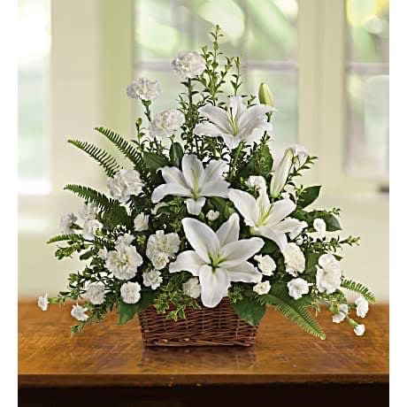 Peaceful Basket Peaceful Basket - A wick basket with lilies and carnations accompanied with fern leafs