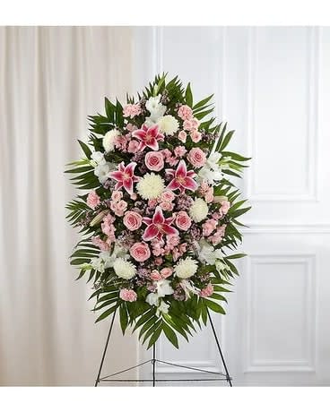 Pink &amp; White Sympathy Standing Spray - The warmth and kindness they showed will live on forever, and sometimes this sentiment is best captured through flowers. Our impressive standing spray arrangement, meticulously handcrafted by expert local florists with soothing pink and white blooms for a lush, full presentation, creates a truly memorable tribute. Standard measures approximately 42&quot;H x 30&quot;L without stand Deluxe measures approximately 46&quot;H x 34&quot;L without stand Premium measures approximately 56&quot;H x 38&quot;L without stand