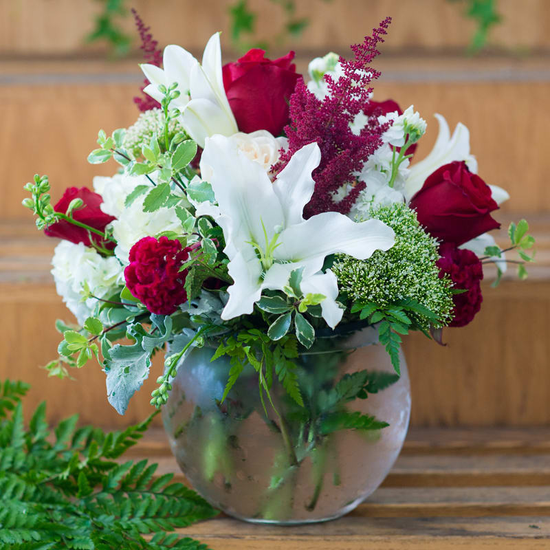 Red, White and Lovely - The name says it all! We pick the finest white and red flowers to make this arrangement. It is perfect for any occasion!   This arrangement is approximately: 14&quot; x 14&quot;