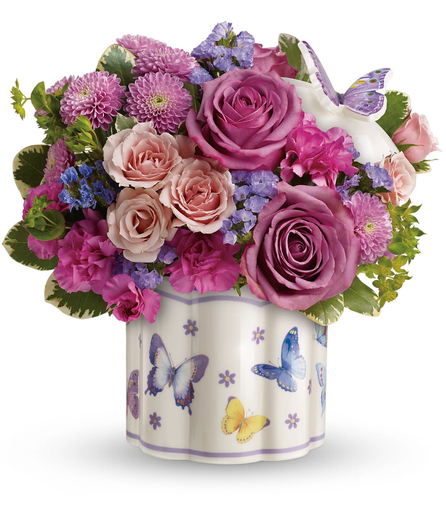  Field Of Butterflies Bouquet - This lush bouquet includes lavender roses, light pink spray roses, dark pink miniature carnations, lavender button spray chrysanthemums, lavender sinuata statice, bupleurum and variegated pittosporum. Delivered in a Field Of Butterflies keepsake box.  All-around SUBSTITUTION POLICY – Always deliver the freshest flowers! Please note the bouquet pictured reflects our original design.  If the exact flowers or container in this arrangement are not available, our local florists will create a beautiful bouquet with the freshest available flowers.  Orientation: All Around  