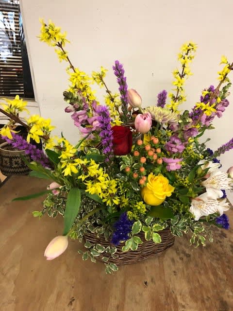 Basket of Fun - Beautiful mixed spring bouquet presented in a basket is sure to bring a smile to anyone.