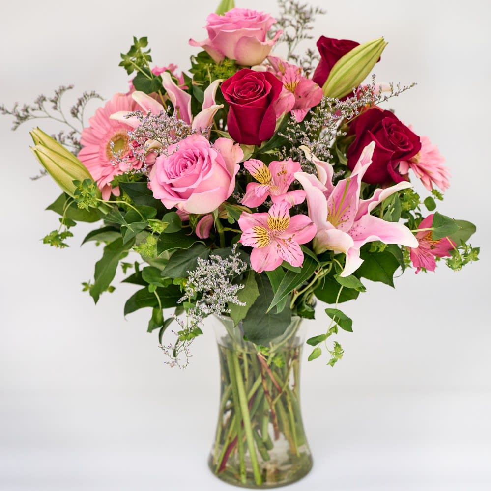 Dreams of Europe - Romance, Valentine's - Inspired by the rich beauty of the European countryside, our romantic bouquet reveals all the feelings you have in your heart. Fresh-picked pink &amp; red blooms are on display inside a glass vase finished with ribbon, creating a timeless gift for someone you love.