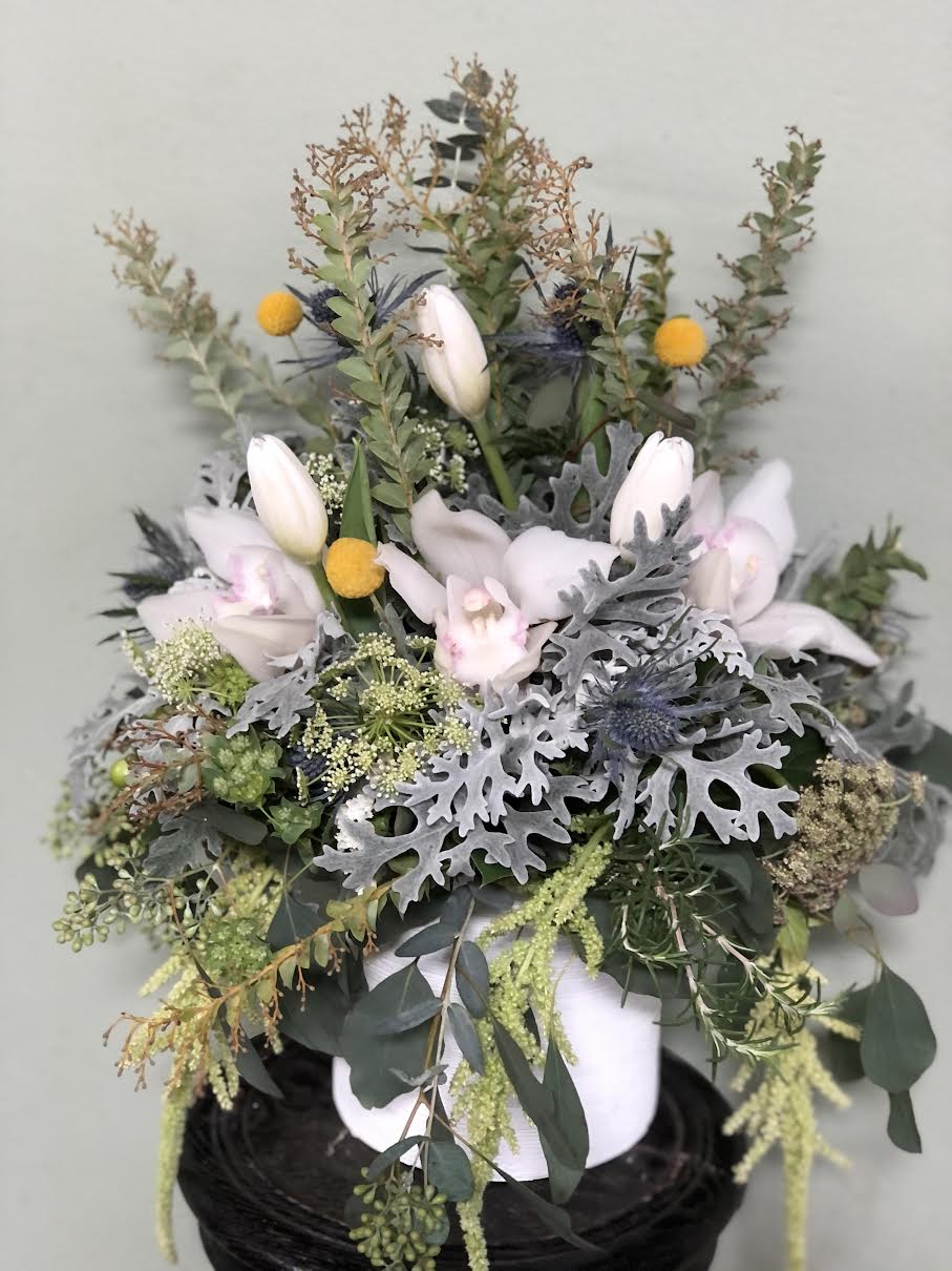 The Wild Wood The Wild Wood - Tulips, Cymbidium orchids, and Nice fillers in Glass vase.