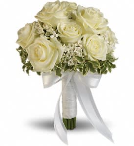 Lacy Rose Bouquet Lacy Rose Bouquet - Delicate white bouvardia and pittosporum lend a lacy look to this breathtaking bouquet of white roses, wrapped with sheer organza ribbon. White roses and bouvardia contrasted by variegated pittosporum.