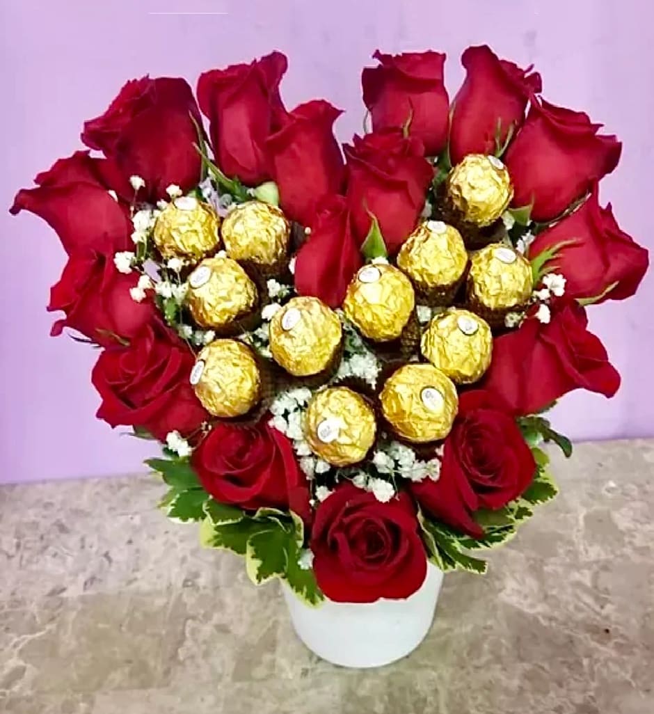 VDay 11 VDay 11 - This beautiful arrangement comes with 16 roses and 12 Ferriero Roches chocolates. (If you are wanting to customize this arrangement for changing colors to the roses options can be ALL "white, yellow, pink or red" please call us to customize this arrangement.)