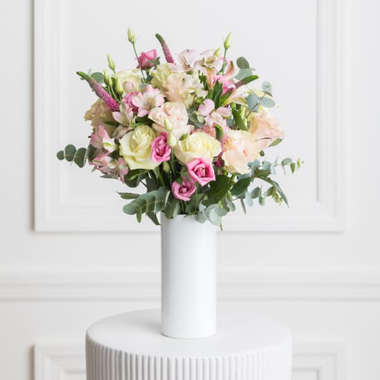 Felice Felice - A timeless bouquet with white and pink roses, pink alstroemeria and lisianthus, pink veronica, and baby blue eucalyptus.