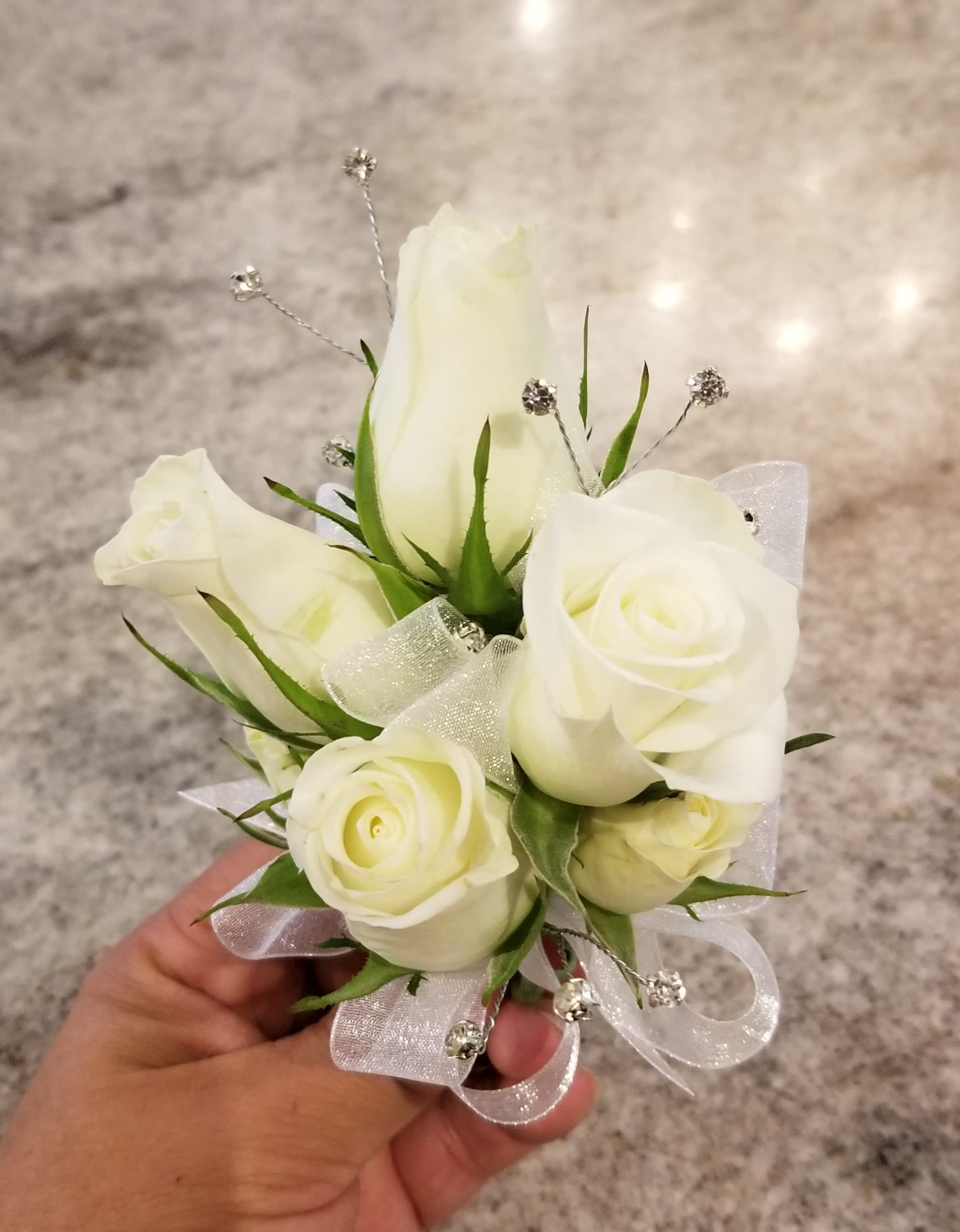White store rose corsage