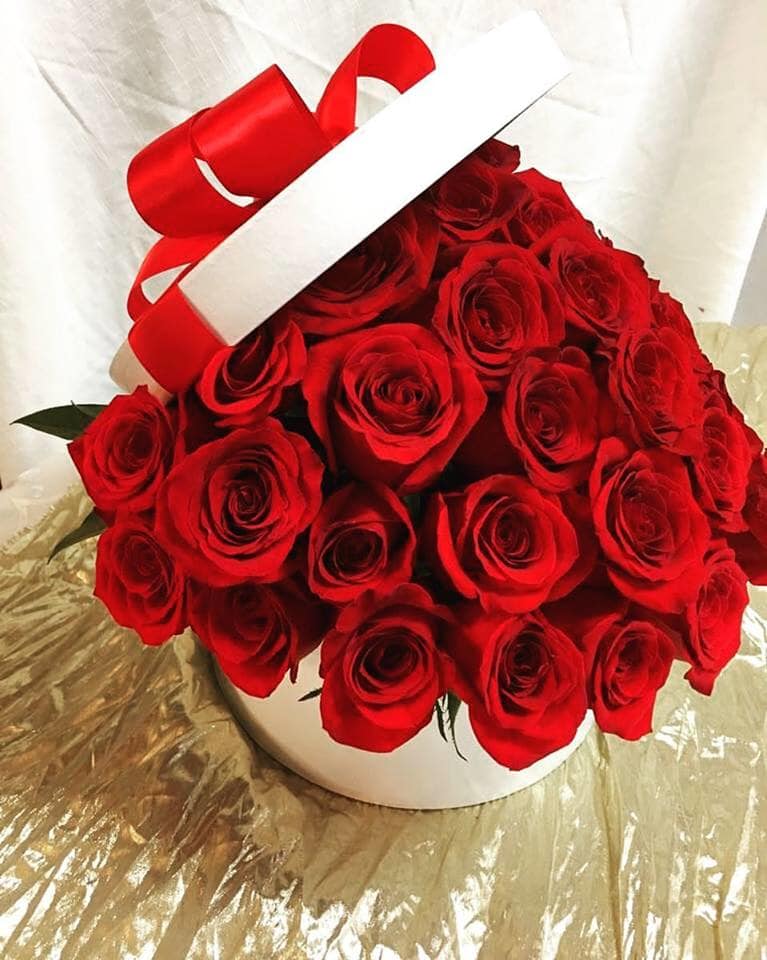 Always in my Heart PLA39 - Red Premium roses arranged in a cylinder white box embellished with a red satin ribbon. Box also available in black.