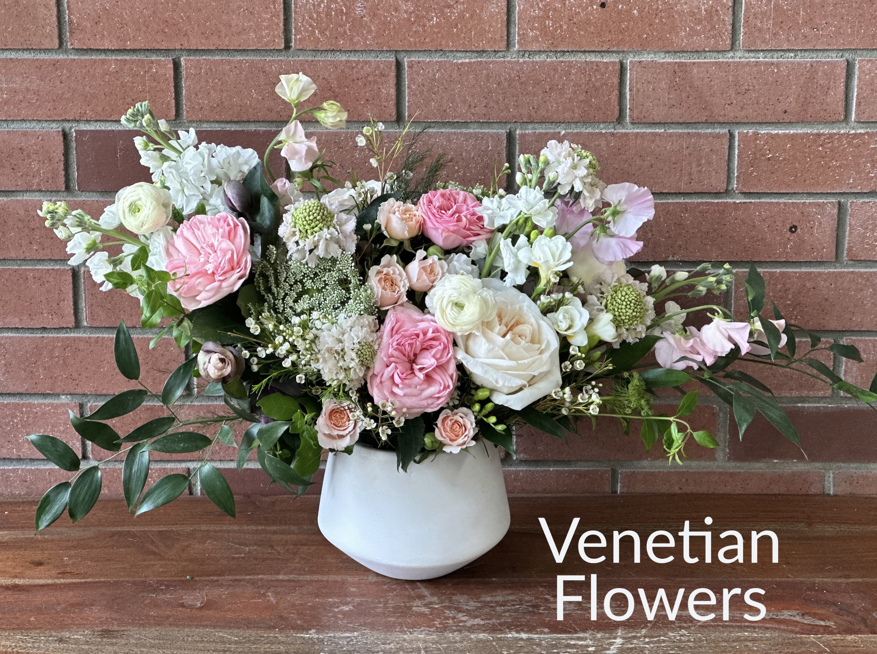 English Garden Bouquet English Garden Bouquet - English garden roses, exotic branches, sweet peas, spray roses, eucalyptus, ranunculus in a white modern ceramic pot arranged Engish garden style