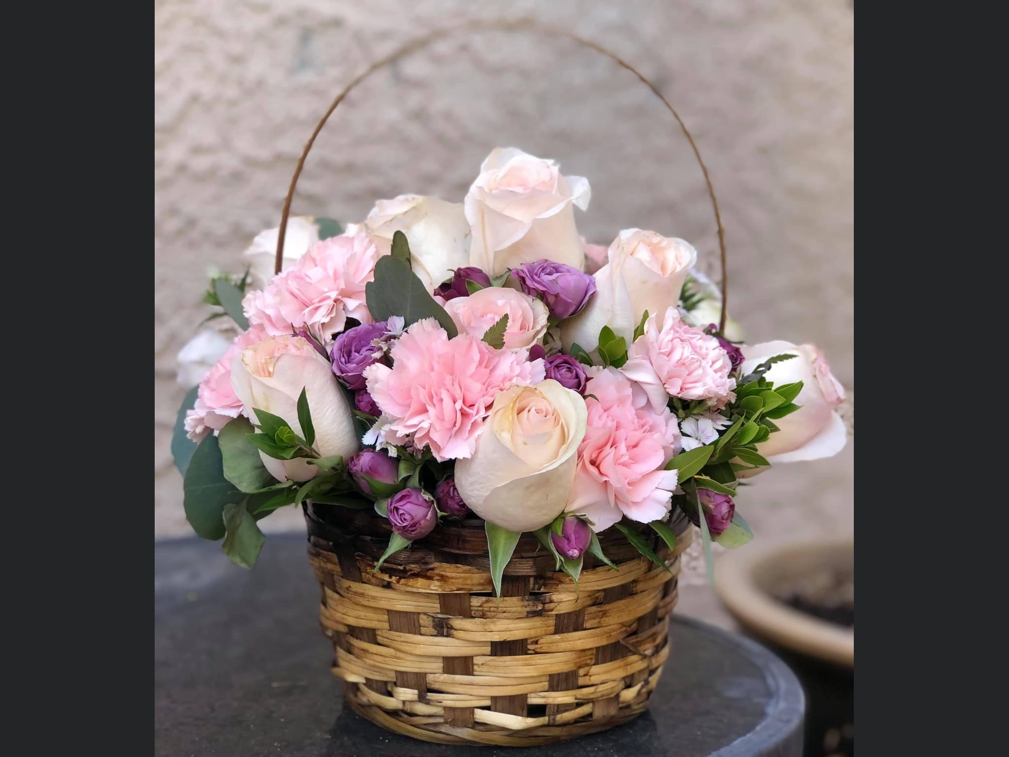 Sweet and Enchanting  - A basket of pastel blooms, the basket comes in medium size. Is perfect for any occasion, remember when ordering roses , each color has a symbolic meaning 