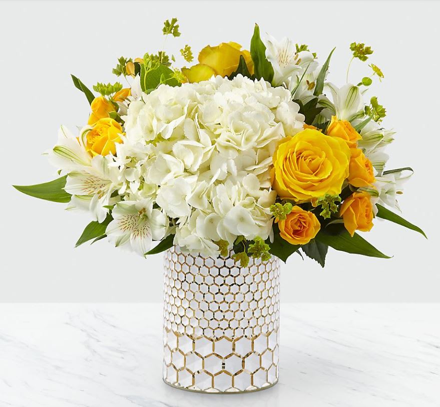 Bees Knees - THE VASE IS NO LONGER AVAILABLE - WE WILL USE EITHER A WHITE VASE OR A SILVER VASE PLEASE PUT PREFERENCE.  The perfect way to remind the most special people in your life that they're the bee's knees! This bouquet is sweet as can be with a combination of yellow roses and white hydrangea blooms, set nicely in a metallic honeycomb vase. Even better, this gorgeous pick comes right from a local florist!