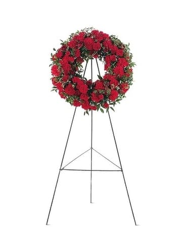 Red Regards Wreath - This simple, yet stylish wreath shows the depth of your love and support. One wreath on an easel arrives with red carnations and roses, along with decorative natural foliages.