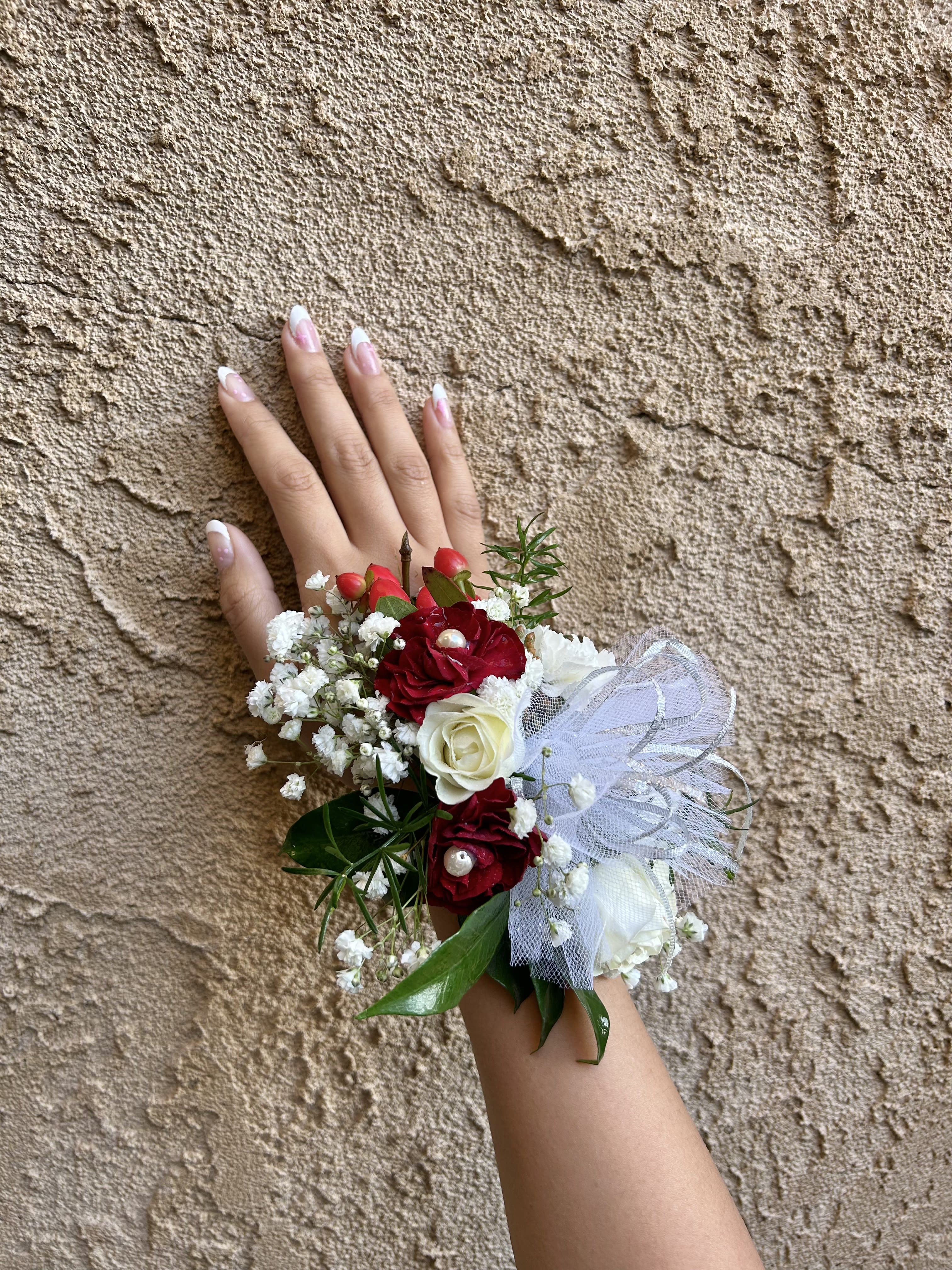 Wrist Corsage 8 - Wrist corsage with white and red flowers with accents. CUSTOMER CAN CHOOSE ANY COLOR STANDARD: WRIST CORSAGE DELUXE: WRIST CORSAGE + BOUTONNIERE
