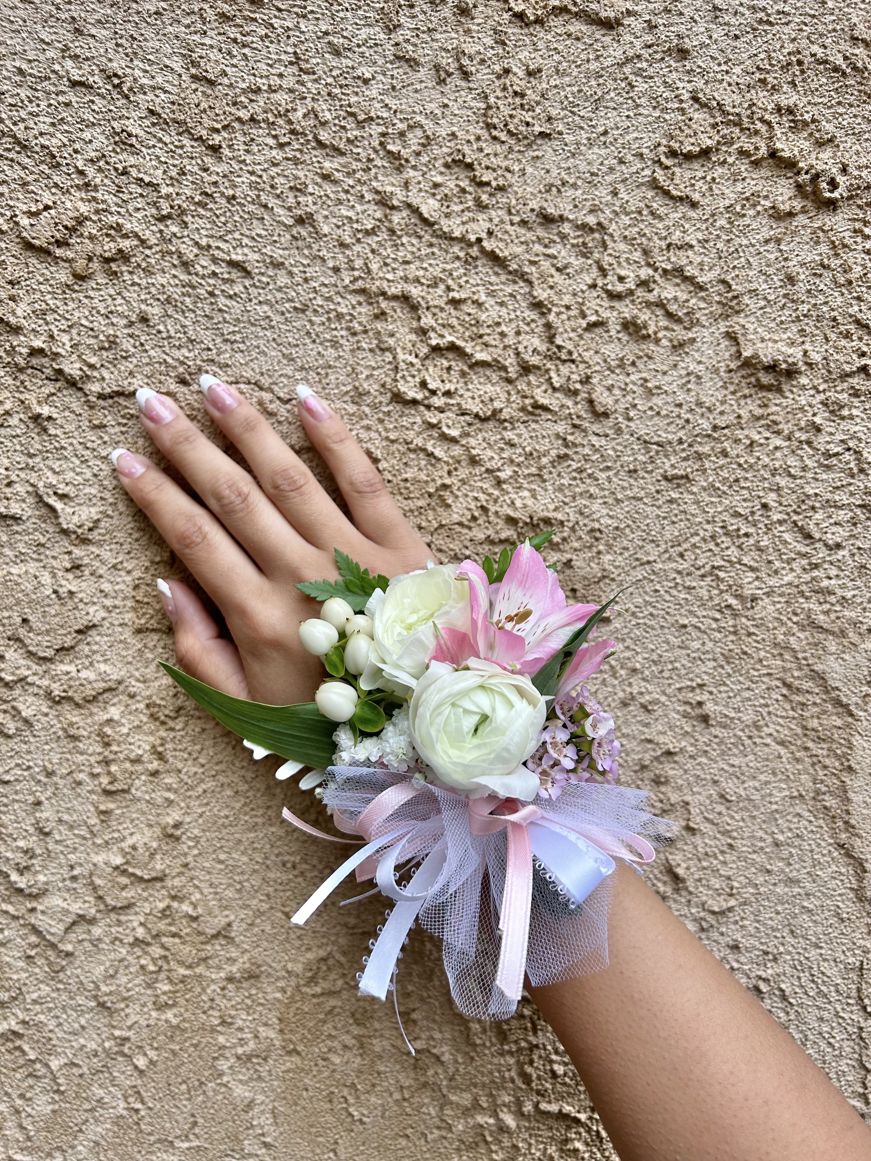 Wrist Corsage 1 - Wrist corsage with white flowers and accents. CUSTOMER CAN CHOOSE ANY COLOR STANDARD: WRIST CORSAGE DELUXE: WRIST CORSAGE + BOUTONNIERE