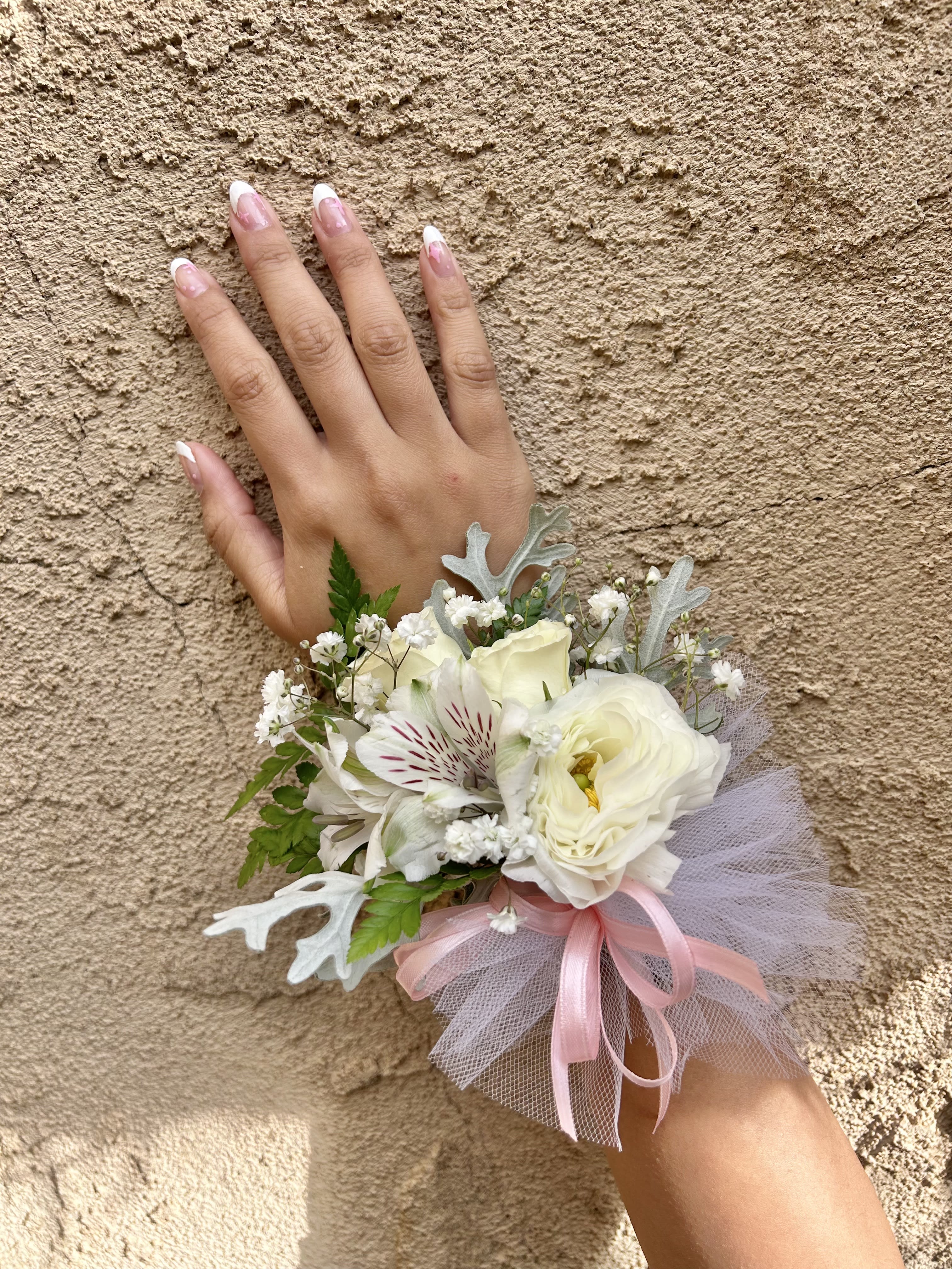 Wrist Corsage 7 - Wrist corsage with white flowers and accents. CUSTOMER CAN CHOOSE ANY COLOR STANDARD: WRIST CORSAGE DELUXE: WRIST CORSAGE + BOUTONNIERE