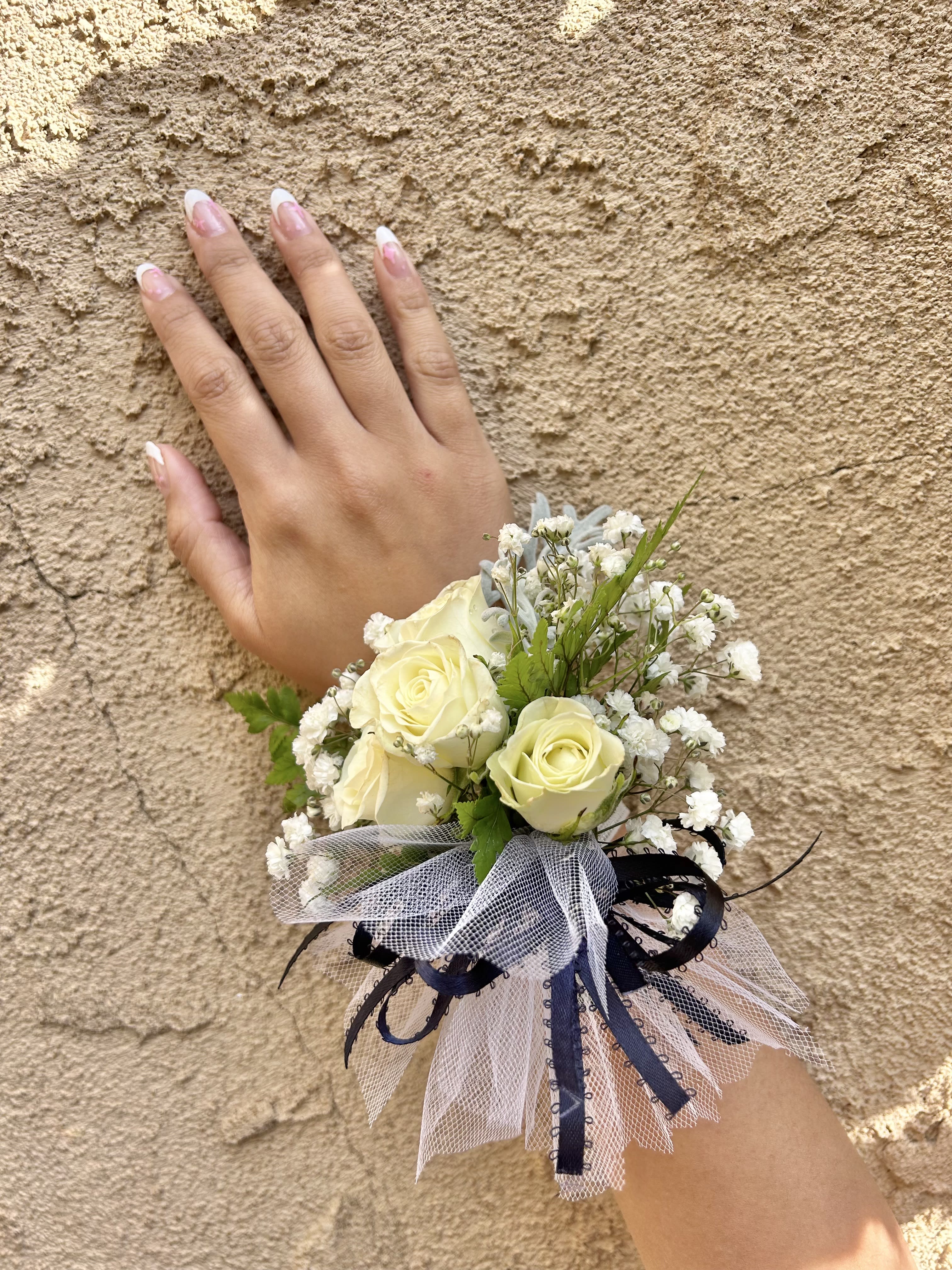 Wrist Corsage 3 - Wrist corsage with white roses and accents. CUSTOMER CAN CHOOSE ANY COLOR STANDARD: WRIST CORSAGE DELUXE: WRIST CORSAGE + BOUTONNIERE
