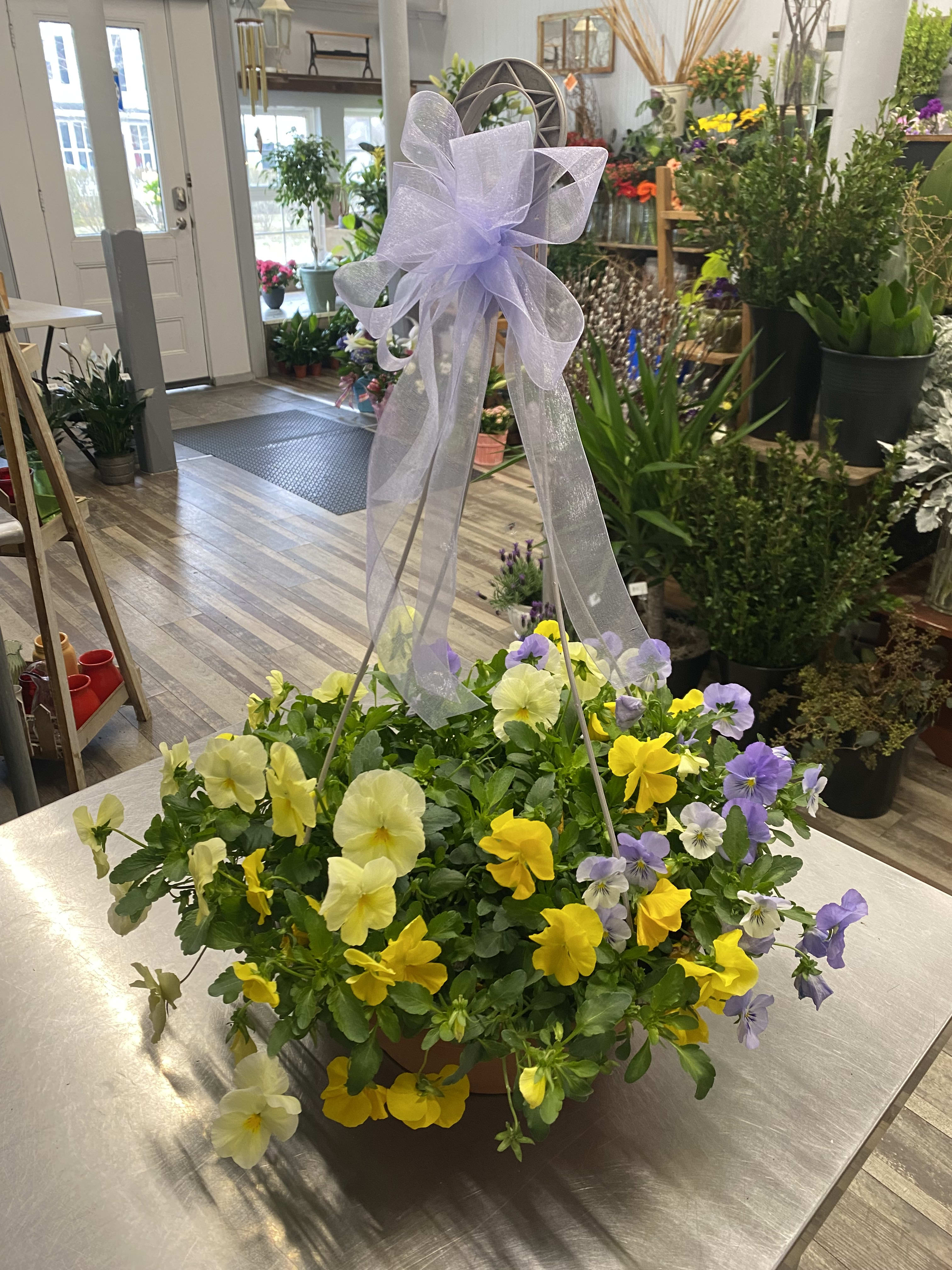 A beautiful hanging basket by Luna's Flower Shop