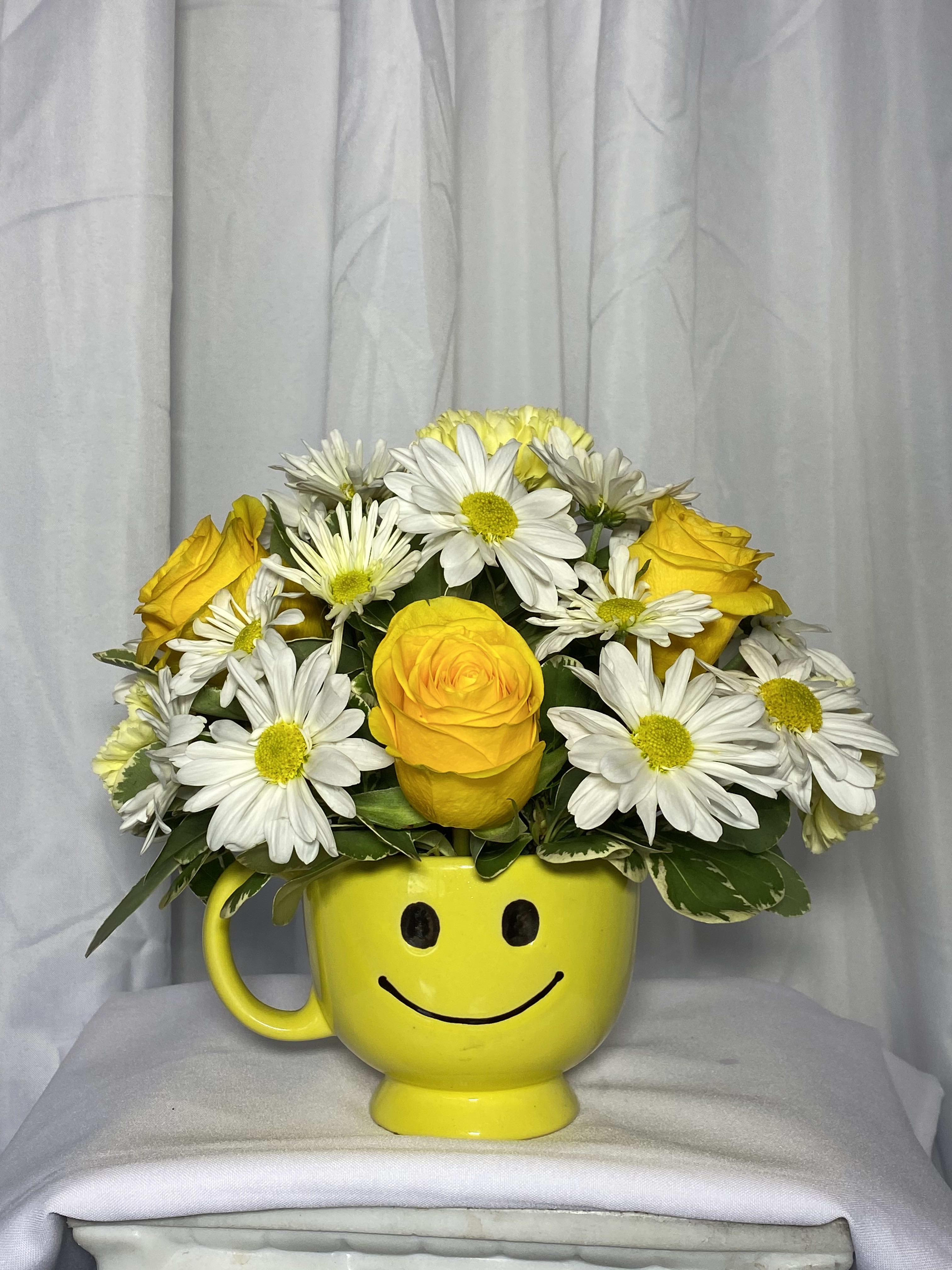 Full of Smiles - Smiles will bloom everywhere this gift goes!You'll be smiling too, when you hear how  happy that special someone was to receive it. Yellow roses ,white daisies, and more
